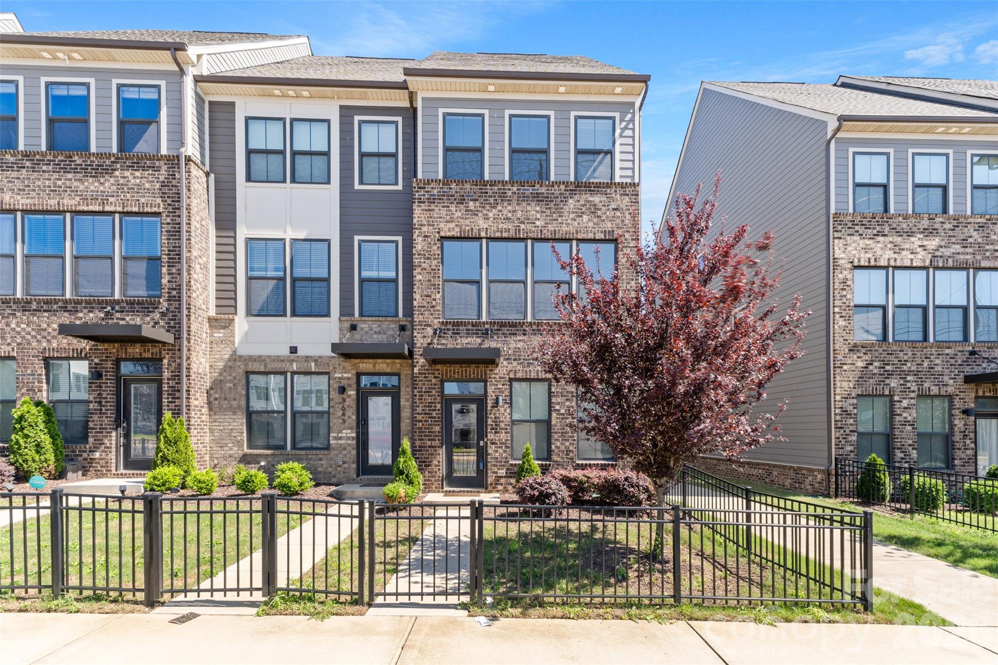 This unit features a 2-car garage with parking area, visitor parking and public street parking.  You are guaranteed 2 spots with the garage which most other complexes don't have- (huge bonus), 3 beds, 3.5 baths. Beautiful three-story town home in South End- walk to Phat Burrito and nearby breweries. Top floor has a bedroom, full bath, loft and large outdoor terrace with partial city views.  Very private.  The main level is open with beautiful modern kitchen- island, stainless steel appliances, refrigerator, tile back splash and large dining area. Large owner's suite with walk in closet. End unit with more windows. Beautiful flooring and selections on this unit. New carpet and fresh paint. Can rent- no wait lists or caps, something other complexes limit so be sure to check. You can park TWO cars in the garage, be sure to mention.