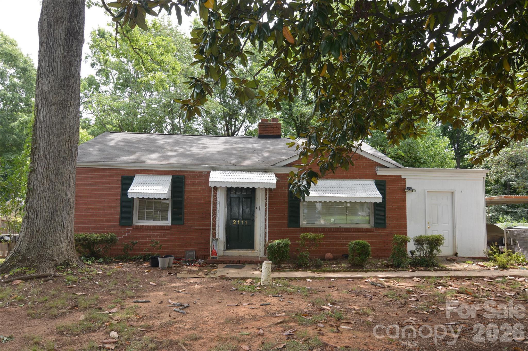 A Cute Parial Brick Home with Tons of Potential in a Great Location.   Located in the Desirable Ashley Park Neighborhood.  Large shade trees in the front and backyard.  Lots of folliage in the backyard for privacy.  The Yard is fully fenced inclucing  the front and backyard.   Roomy .22 Acre Lot.  Carport with Extra large driveway.     Tenant is on month to month lease.  Roof Updated in 2024.   House is being managed by Four Seasons Property Managment Company.   5 years of maintenance items upon request.   A Great Home for a Private Owner or an Investor.