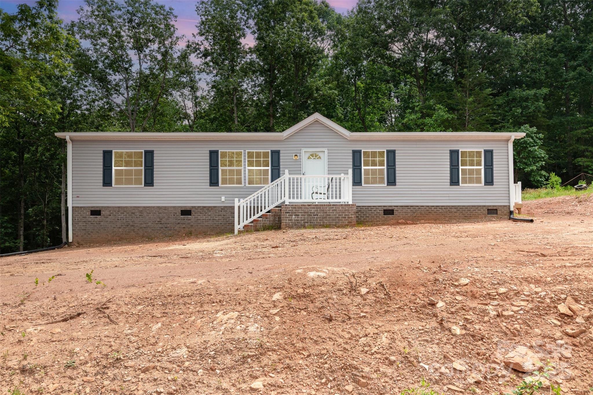 Welcome to your own private retreat! This brand-new 3-bedroom, 2-bath home, built in 2024, offers 1,514 square feet of thoughtfully designed living space on nearly 3 acres of peaceful land. Inside, you'll find fresh carpet in all the right spaces, brand-new appliances, and stylish modern finishes throughout.

Step outside and enjoy your morning coffee or unwind in the evening on not one, but two spacious decks, perfect for soaking in the natural surroundings and fresh country air. Experience the serenity of rural living while staying just minutes from Gastonia and Kings Mountain Casino, with convenient access to shopping, dining, and entertainment.

Whether you're dreaming of a homestead, a garden oasis, or simply a quiet place to call home, this property offers the perfect blend of comfort, privacy, and modern convenience. Don’t miss your chance to own a slice of tranquility with all the perks of a brand-new home!