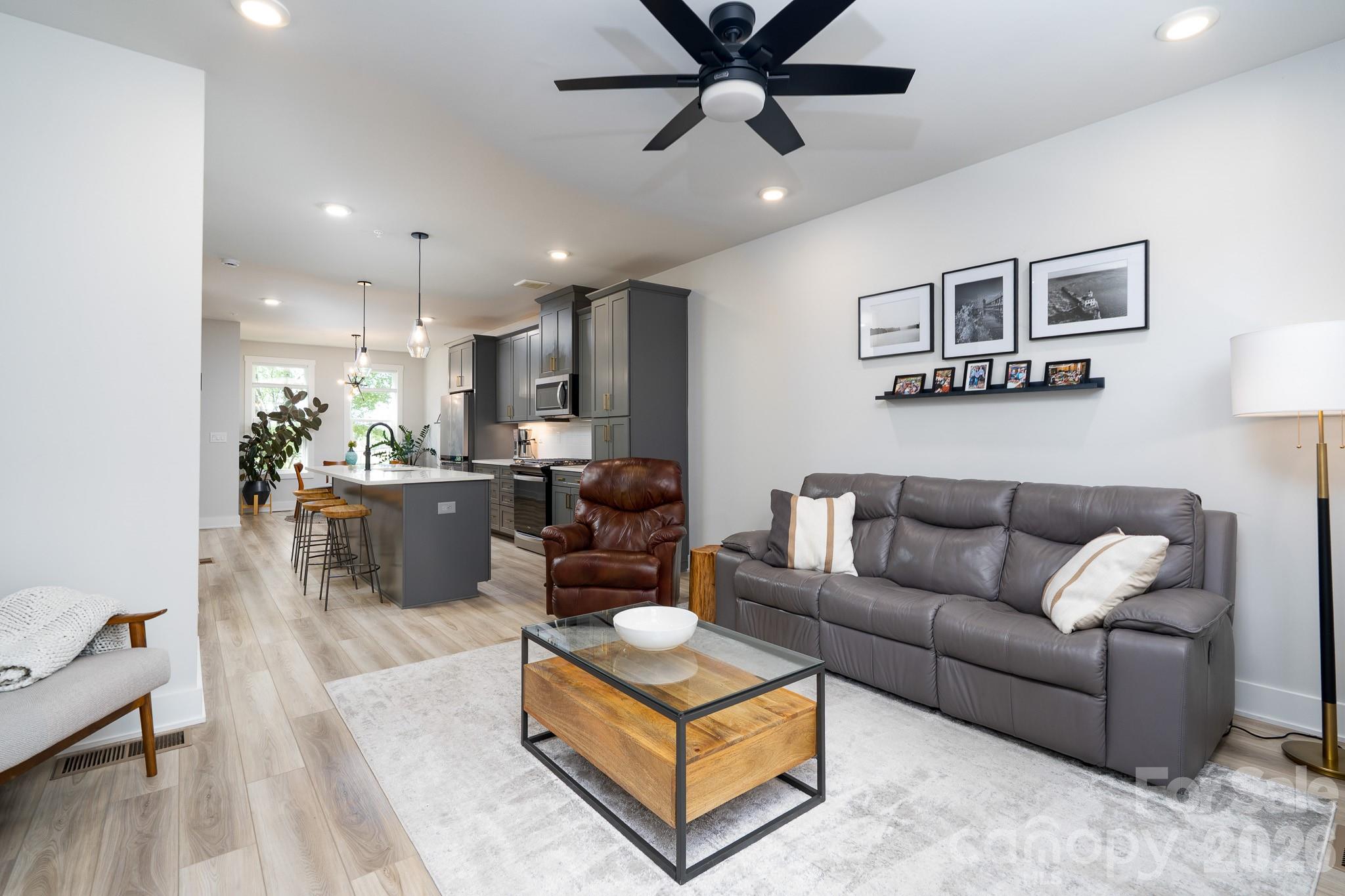 Sophisticated yet comfortable, this beautifully designed condo puts you right in the heart of South End and just minutes from everything that makes the neighborhood so popular. With three bedrooms, three-and-a-half baths, and nearly 2,000 square feet, the home offers a thoughtful layout that feels both stylish and easy to live in. Natural light pours through the open-concept living spaces, highlighting designer finishes, quality fixtures, and modern touches throughout. The outdoor spaces truly set this home apart. Grill dinner on the patio just off the great room, then head upstairs to the private rooftop terrace for sunset views, cocktails with friends, or a quiet evening overlooking the skyline. Just steps from the Rail Trail, restaurants, breweries, fitness studios, and boutique shopping, this turnkey home offers the best of South End living. Nearby Brookhill Village redevelopment is set to bring even more energy to the area with planned short-term rentals and festival grounds. New music venue The Auxiliary coming to South End in 2027 is within walking distance: https://www.axios.com/local/charlotte/2026/06/01/new-music-venue-south-end