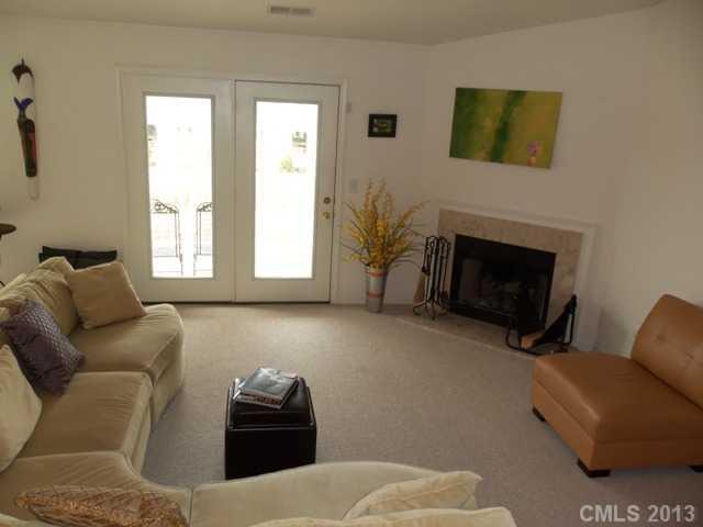 Amazing 3rd floor unit features vaulted ceilings, wood-burning fireplace. Split BR floor plan. Open kitchen w/breakfast bar, cherry finish cabinets (decorative glass front corner & pantry style). Huge open living area & dining area. Fabulous master bath:soaking tub, raised double sink vanity.Laundry Rm. Secure building w/intercom. Minutes to UNCC-Easy access to I-85. Pool, Fitness Cntr & Clubhouse