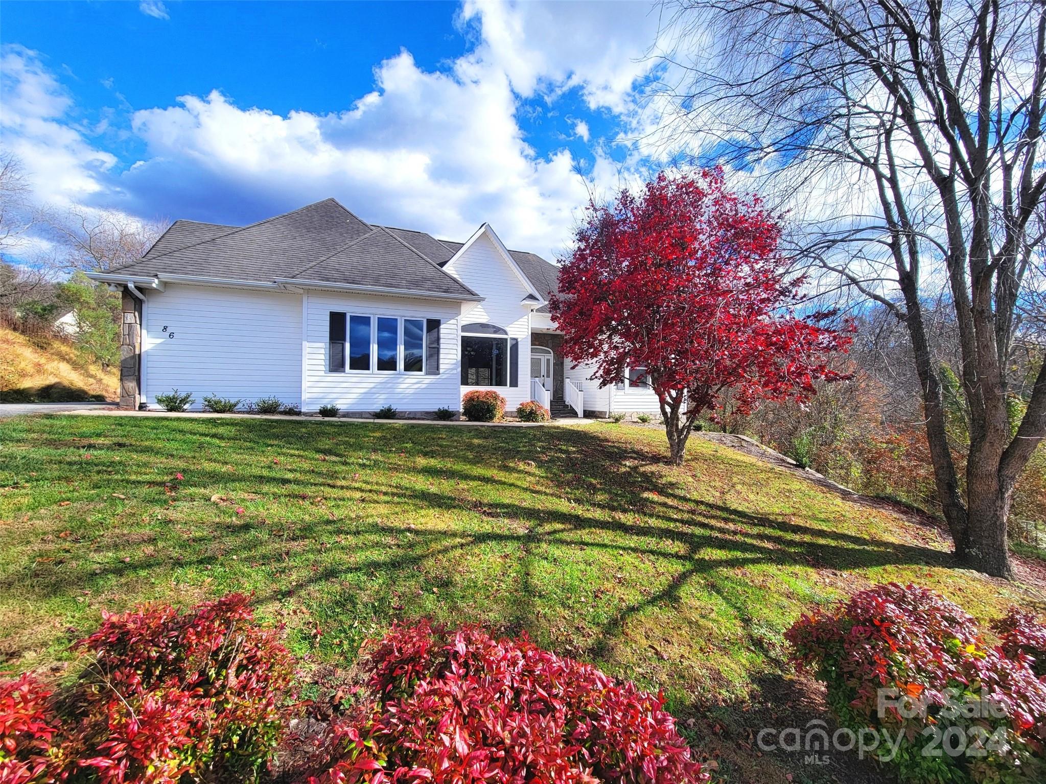 Located in a gated neighborhood, this home welcomes you with high ceilings, hardwood floors, new appliances, and a 2nd living area on the lower level. Entering the foyer, the dining room (12ft ceiling) has mountain views. The kitchen offers stainless appliances, open to the breakfast area, great room (9ft ceilings) with a fireplace, and a deck. One-level living also includes the primary bedroom with ensuite bath and private deck, 3 more bedrooms, laundry room, full bath, and half bath. Moving to the 800+SqFt finished lower level there is a spacious family room with another fireplace, full bath, laundry room and covered patio wired for a hot tub – 2nd living quarters for guests. For storage, this level also has 600+ SqFt of unfinished basement/utility area. The 2-car garage (461 SqFt) has a workbench area, with plenty of additional parking in the driveway. Fenced yard, underground power, Spectrum Internet-TV, city water/sewer.