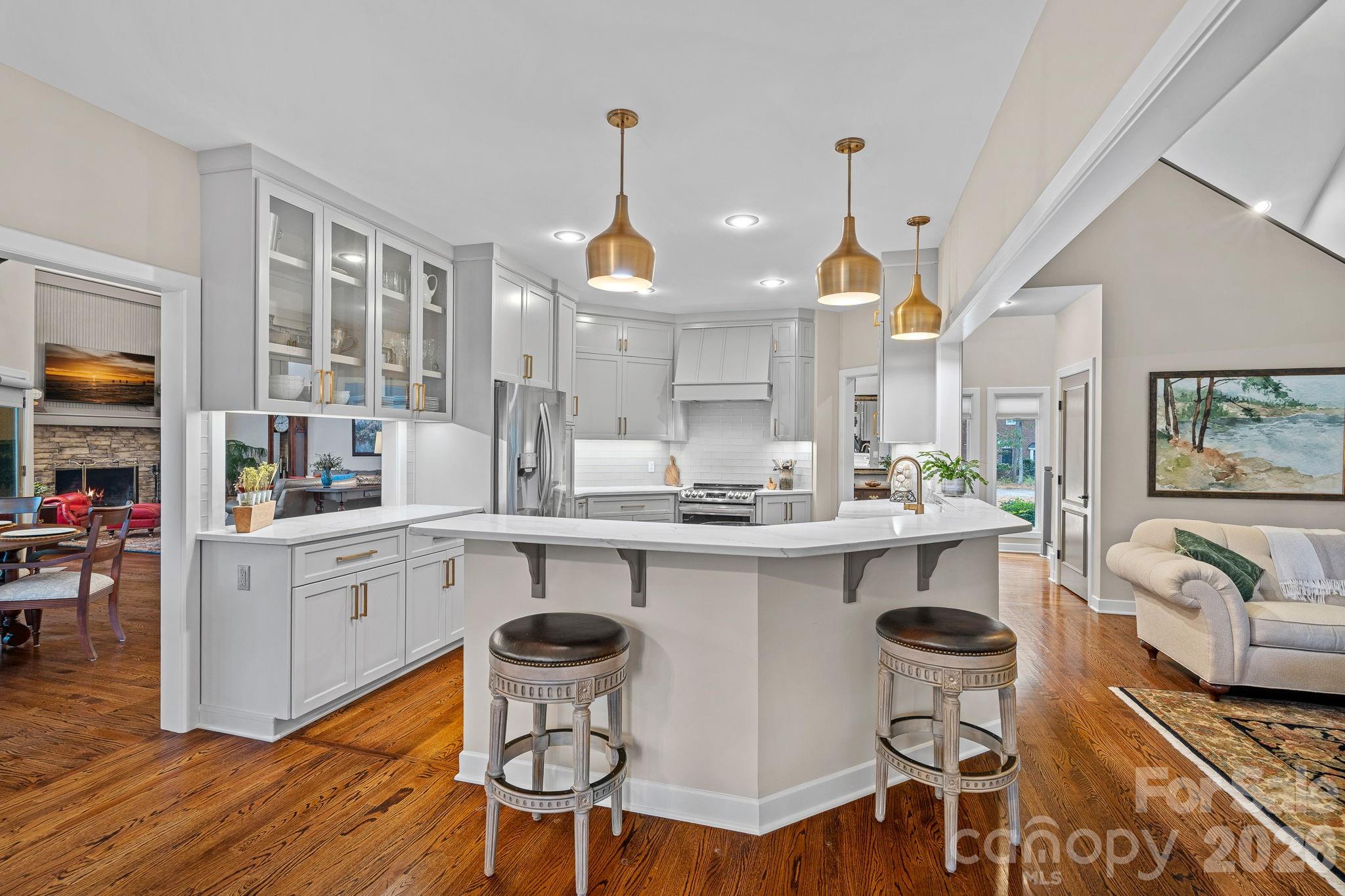 Welcome to this stunning stone and cedar two-story home, perfectly situated on Hole 12 inside the gated community of Uwharrie Point. Surrounded by the breathtaking Uwharrie Mountains and the prestigious Old North State Club — a private Tom Fazio-designed championship golf course that opened in 1992 along the shores of Badin Lake — this property offers an unmatched lifestyle of luxury, leisure, and natural beauty.

Step inside to discover a beautifully updated kitchen and refreshed baths throughout the home. Thoughtful finishes blend timeless charm with modern comfort, creating spaces that are both elegant and inviting.  The second floor offers plenty of room to relax and entertain. You'll find two additional bedrooms, two additional baths, and a huge bonus room complete with a custom bar — the perfect spot for hosting friends and family after a day on the course.

Start your mornings with coffee on the screened-in back porch, where you can take in the peaceful views of the golf course.


A Little About The Community:
Uwharrie Point is a gated community built around the Old North State Club, a Tom Fazio masterpiece recognized as one of North Carolina's premier private golf experiences. Residents enjoy access to championship golf, lakefront amenities on Badin Lake, and the quiet beauty of the Uwharrie Mountains right outside their door.
This is more than a home — it's a lifestyle.