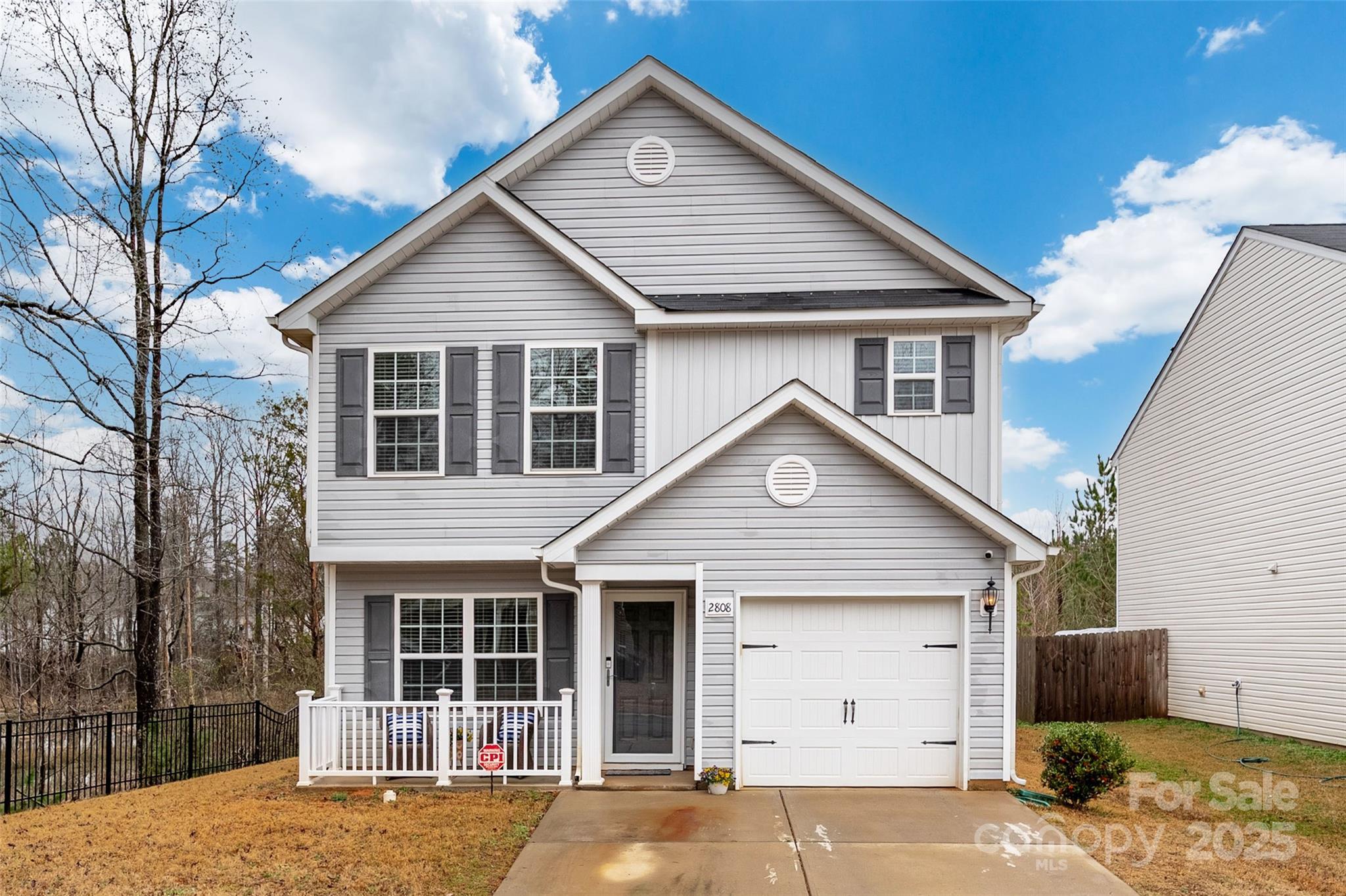 This home is eligible for 100% financing or down payment assistance loan programs. This meticulously maintained home is a MUST see. Think open floor plan, white cabinets throughout, granite countertops in the kitchen, French doors leading out to the extended patio in the fully fenced in backyard. The primary bedroom features stunning cathedral ceilings, creating a spacious, airy atmosphere. The home’s primary closet and garage are designed with custom, built-in shelves, maximizing storage. Step outside to find an expansive front porch and an extended back porch, perfect for enjoying the outdoors. This home is tucked away at the end of a quiet street surrounded by trees offering a sense of tranquility and seclusion.  Additionally, the property includes a gazebo and a shed adding charm and extra storage space to the large outdoor area. The outdoor space is very private which is perfect for relaxation and entertainment. Once completed, you will have access to the Paw Creek Greenway.