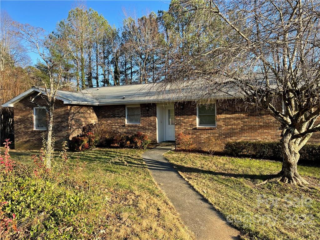 Great retirement 2/2 home w/ finished basement, & a deck off of the living room overlooking trees, & a pond w/ a hidden dam that creates the hypnotic sound of falling waters 24/7. Homesite sits on a 0.29-acre lot w/ direct access to an open field along a pond that provides peaceful scenery & relaxing sounds. The DUPLEX common hallway separates both units offering more privacy. The basement below provides an additional 324 sqft. of living space perfect for any type of studio + extra storage. Residents at this 55+ community in Brookside Manor pay no HOA. Desirable locations surrounded by rolling hills & inviting country settings. One of the very few homes available where the night sky is uninterrupted by light pollution. Conveniently on well water & community septic, fewer utility bills & no need to stress over city water outages. 7 mi away from AVL Regional Airport & 5 mi away to DT Hendersonville, 8 mi to Flat Rock Playhouse, golf courses, wineries, apple farms, parks & trails.