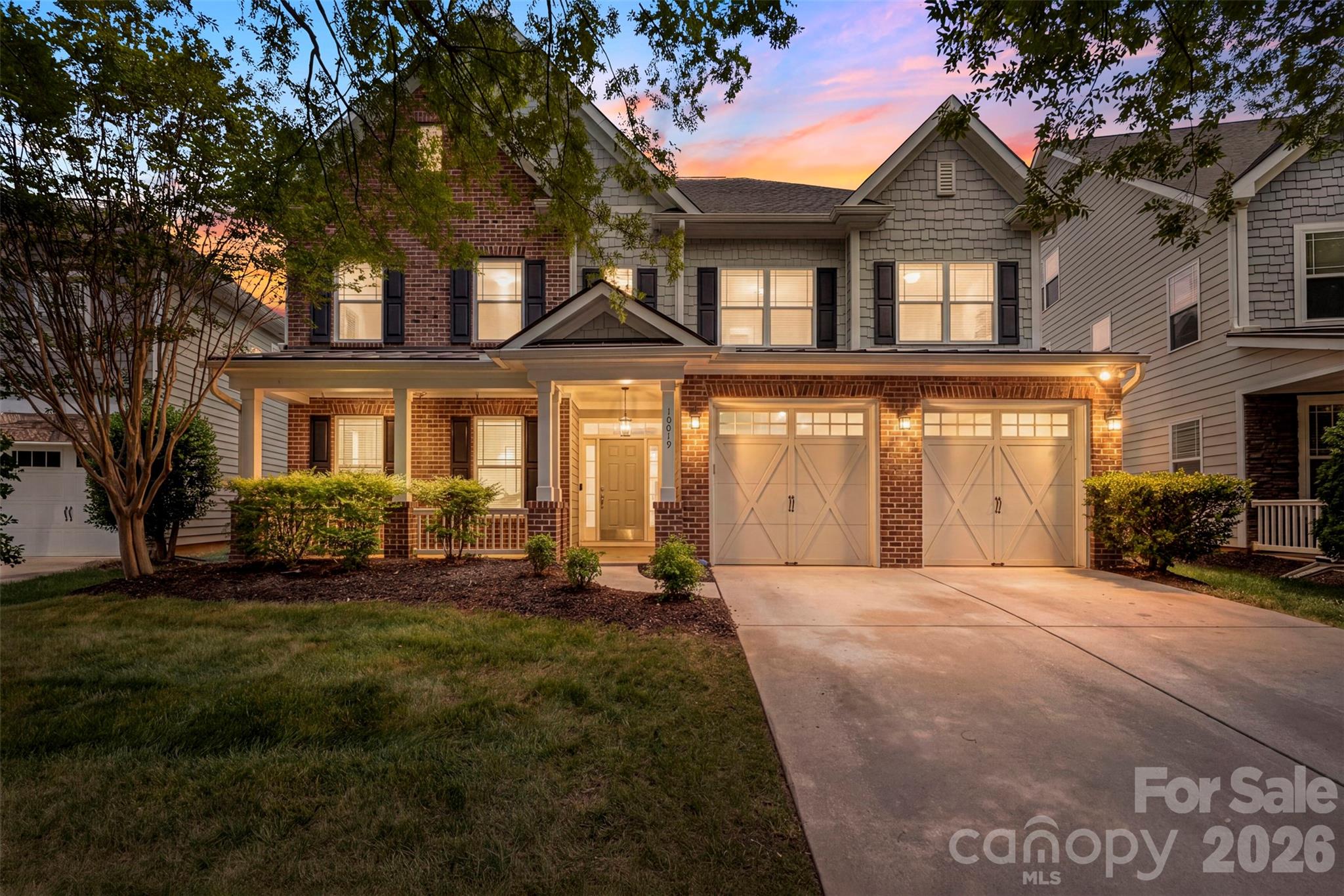 Rare. Refined. One of the crown jewels of Ardrey Crest.
From the moment you step inside, 10019 Elizabeth Crest Lane commands attention. One of the largest homes on one of the most coveted lots in the community, this stunning 5-bedroom, 4-bath residence spans over 4,000 square feet of thoughtfully designed living space — freshly updated and move-in ready.
A dramatic two-story foyer and great room greet you with soaring ceilings, a wall of clerestory windows, and an elegant staircase featuring rich wood handrails and custom iron balusters. New waterproof QuickStep NatureTEK Select laminate flooring flows throughout the main level — 12mm thick and backed by a lifetime warranty. Updated lighting throughout completes the refresh. The formal dining room stuns with decorative columns, classic wainscoting, and sophisticated pendant lighting — the perfect backdrop for elevated entertaining. The chef's kitchen delivers with double ovens, a gas cooktop, pantry, and a generous bar counter, opening seamlessly to the breakfast area and family room for effortless everyday living. Slab foundation. Step outside and nothing in this neighborhood compares — a private putting green, expansive flat yard, and full front and back irrigation system create an outdoor retreat that simply cannot be replicated at this price point in South Charlotte.
Community amenities include a resort-style pool, fire pit, bocce ball court, nature walking trail through the greenway, playground, and open greenspaces — all just minutes from Blakeney, Stonecrest, Waverly, Rea Farms, the Ballantyne Bowl, and I-485.  Zoned for Knight View Elementary, Community House Middle, and Ardrey Kell High School.
This is the one. Welcome home.