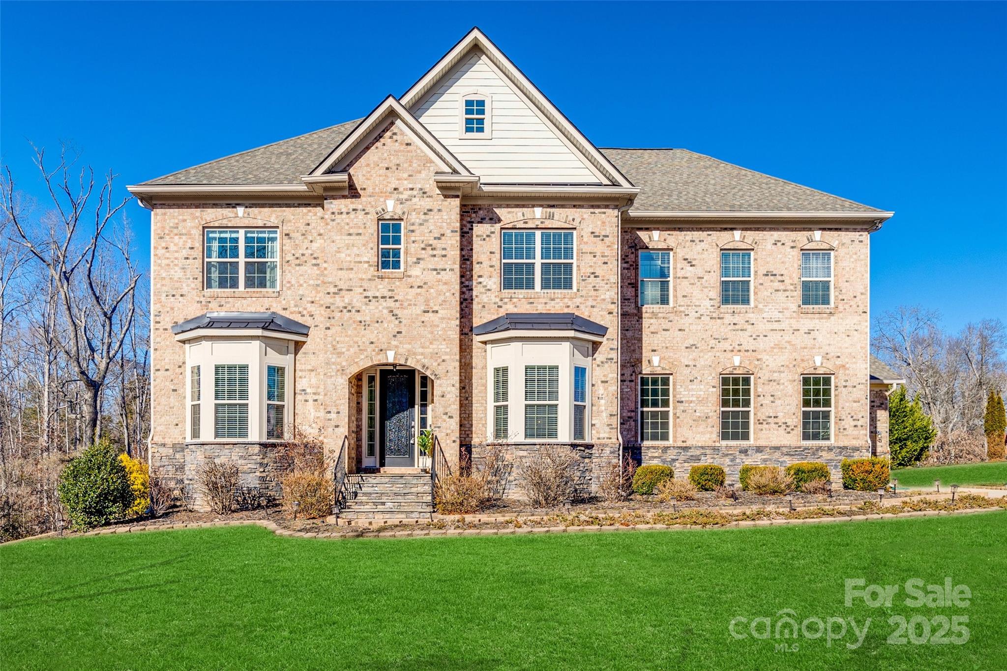 Welcome to your dream home only 5 minutes from Lake Wylie public access! This stunning property has 5 spacious bedrooms and 3 1/2 bathrooms, providing ample space for both relaxation and entertainment. As you enter, you're greeted by a grand foyer that seamlessly flows into an open-concept living area, perfect for hosting gatherings, or enjoying quiet family moments. The gourmet kitchen is a chef's delight with a gas stove and SS appliances. The main floor primary bedroom boasts a luxury bath and large walk-in closet. Convenience is key with the home's private elevator, providing access to all levels. Each additional bedroom is generously sized, with plenty of natural light and extra large closets. Enveloped by a lush screen of privacy trees, this expansive outdoor space offers a secluded retreat away from the bustle of everyday life. Don’t miss your chance to experience this extraordinary property—schedule your tour today!