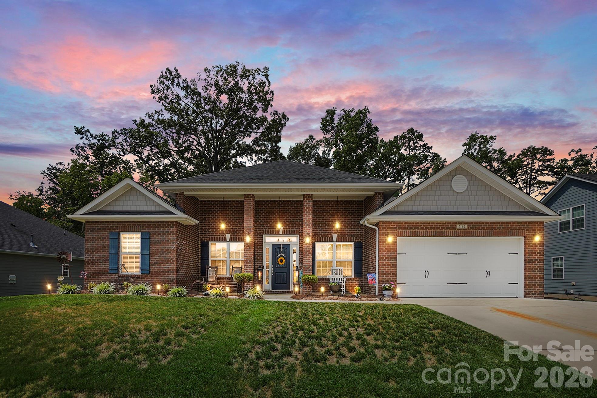 Live and play in the beautiful Red Bridge Golf Course Community! This well-maintained ranch home, built in 2019, offers 4 bedrooms, 2 baths, and over 2,100 square feet with a comfortable split-bedroom floor plan. The inviting front brick exterior with brick columns adds great curb appeal, while the open main living area makes everyday living easy. The family room features a fireplace and flows into the breakfast area and kitchen, creating a great space for gathering and entertaining. The home also offers a dining room and a flex room currently being used as an office, giving you extra space to fit your needs. The spacious primary suite is tucked away on one side of the home and includes a private bath and two walk-in closets. Three additional bedrooms are located on the opposite side, giving everyone room to spread out. Enjoy outdoor living with a covered back porch, paver patio, and backyard shed for extra storage. Conveniently located near Red Bridge Golf Club, shopping, dining, Starbucks, Jersey Mike’s, Walmart, and more. Easy access to I-485, Charlotte, Concord, and surrounding areas. A great opportunity to enjoy a peaceful, small-town feel with nearby conveniences!
