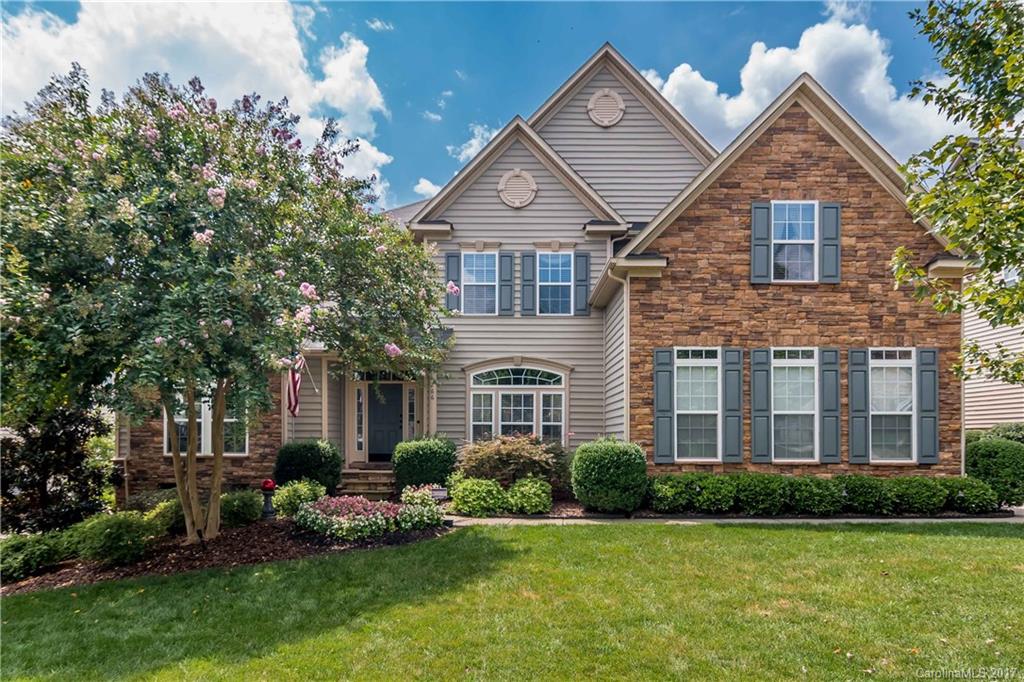 Bright, open, spacious w/over $50,000 in upgrades describes this true masterpiece! Custom carpeting in LR & Masterbedrm. Huge master w/sitting area & wrap around windows. Gourmet kit w/granite island, custom cabinetry, double oven & roll out trays. Large bonus and secondary rooms. Trey ceilings & heavy moldings thru out. Over sized deck w/awning. Phenomenal lush landscaping on entire lot.  Detailed list of upgrades too numerous to list here. Add top rated Fort Mill Schools for a perfect home.