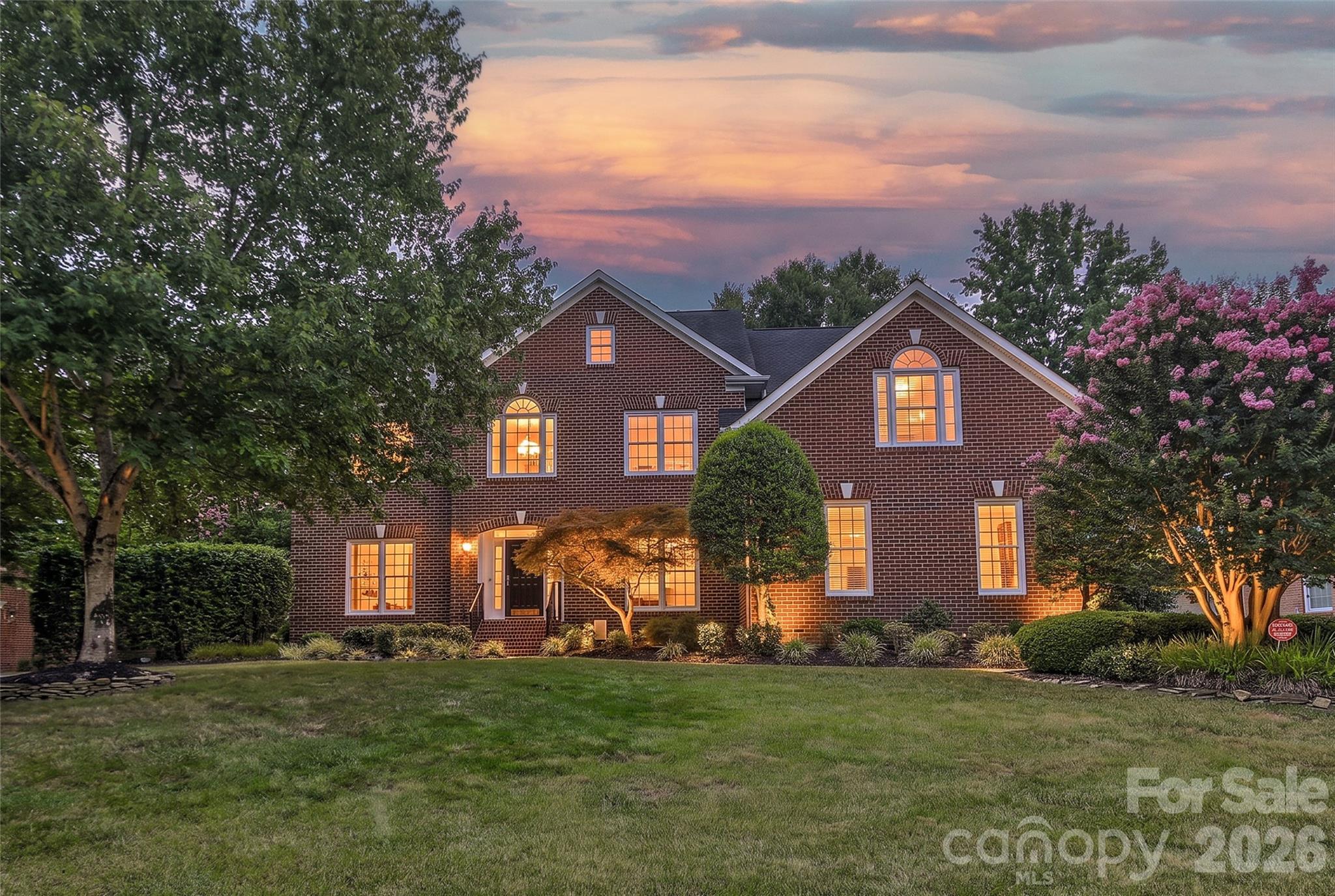 Welcome home to this pristine, one-owner full brick residence where timeless elegance meets exceptional comfort. Move-in ready, this beautifully maintained home features gleaming refinished hardwood floors, fresh interior paint throughout, and brand-new carpet.
A light-filled two-story foyer creates a grand first impression, flanked by spacious formal living and dining rooms highlighted by graceful arched doorways. The elegant dining room includes a Butler's pantry, making entertaining effortless. The inviting great room is centered around a cozy gas log fireplace and opens through French doors to a stunning, heated and cooled sunroom, offering year-round enjoyment.
The well-appointed kitchen is designed to impress with abundant cabinetry, granite countertops, stone backsplash, under and over cabinet lighting, and premium appliances including a gas cooktop, wall oven, microwave, warming drawer, dishwasher, and refrigerator. A generous walk-in pantry, thoughtfully designed laundry room with custom cabinetry, and convenient drop zone add everyday functionality.
Retreat upstairs to the spacious primary suite featuring a double tray ceiling, elegant chandelier, in-ceiling speakers, and an oversized custom walk-in closet. The luxurious ensuite bath offers dual vanities, a soaking tub, separate tiled shower with frameless glass enclosure, tile flooring, and a private water closet. Secondary bedrooms are generously sized with ample closet space, Bedrooms 2 & 3 share a bath, and a 3rd bath is located in the hallway.
The versatile media room, complete with equipment, provides the perfect gathering space and is conveniently connected to the kitchen via a rear staircase. A finished third level offers endless possibilities as a home office, playroom, fitness room, or creative studio, along with valuable walk-in attic storage.
Outdoor living is equally impressive with a charming brick paver patio featuring a soothing fountain and outdoor fireplace—ideal for relaxing or entertaining. Additional highlights include a side-load garage with epoxy flooring, built-in storage cabinets, tool nook, fenced backyard, mature landscaping, and an irrigation system.
Ideally located just minutes from I-485, parks, the library, and an abundance of shopping and dining, this exceptional home combines quality craftsmanship, thoughtful updates, and an unbeatable location. Don't miss the opportunity to make this remarkable property your next home.