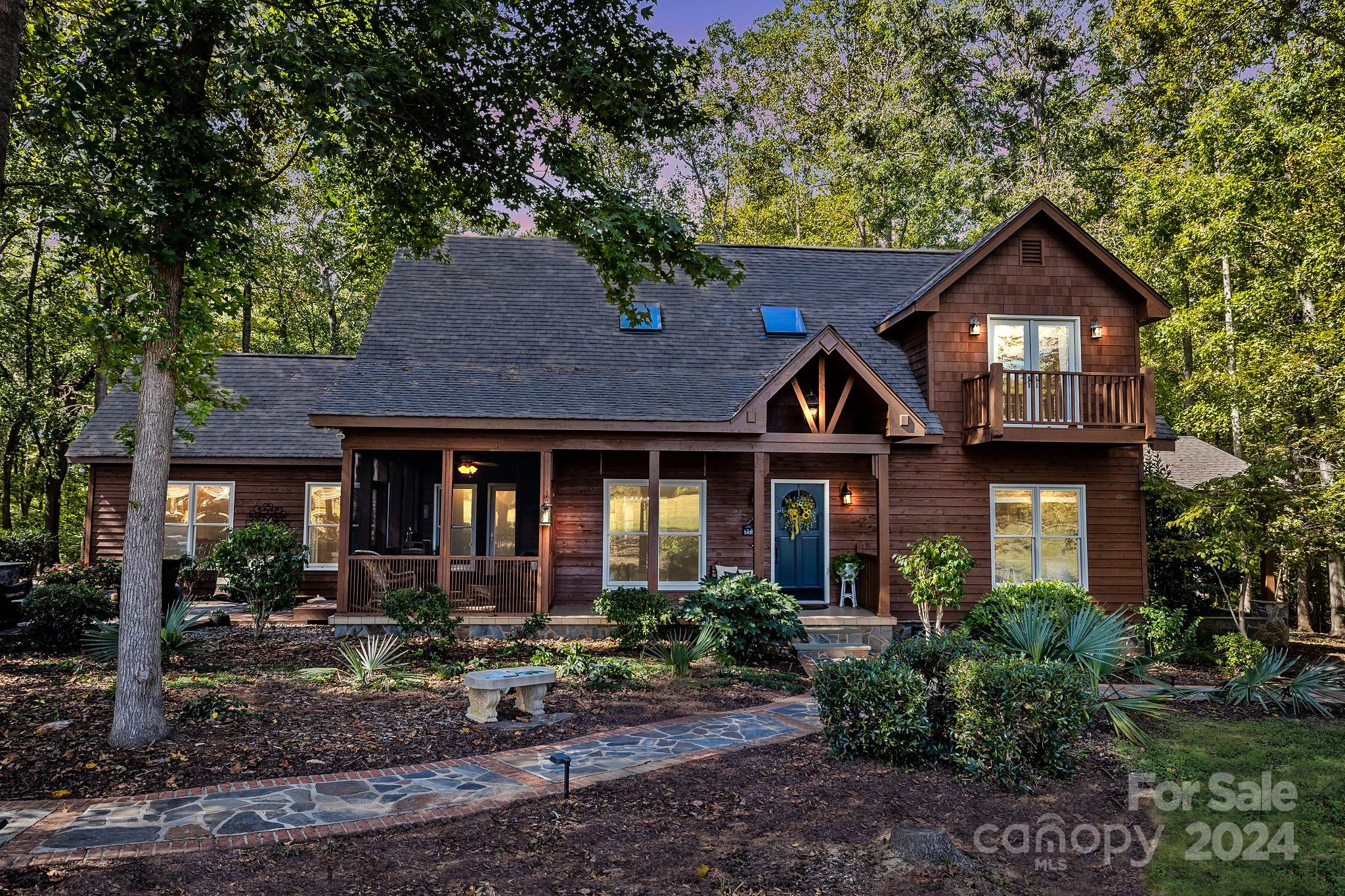 THE EQUESTRIAN FARM YOU HAVE BEEN WAITING FOR! Perfect amenities to board, ride & train horses all on pristine, flat 26 acres convenient to York. Custom built cedar home combines rustic charm & modern amenities  featuring large primary suite on first floor. 4 BR, 3BA open floor plan w/ multiple covered & screened porches. Home features Indian slate floors, crafted rustic pine, blue ridge stone & hickory cabinets. Barn includes 5 stalls, insulated tack room with 1/2 bath, hot water, loft & gravel wash pad. Grounds include paved driveway, 16 acres fenced into 3 separate pastures, riding arena, 60 ft round pin, jump fence, shavings pit, screened Gazebo, 24x16 wired shop with 24x10 shed attached, dog wash station w/ hot water, rock entrance and acres of hardwoods.  Property is so tranquil and secluded yet only 10 minutes to major shopping and restaurants. Whether you're a seasoned rider or simply yearning for a tranquil retreat, this farm promises a slice of paradise in the heart of York.