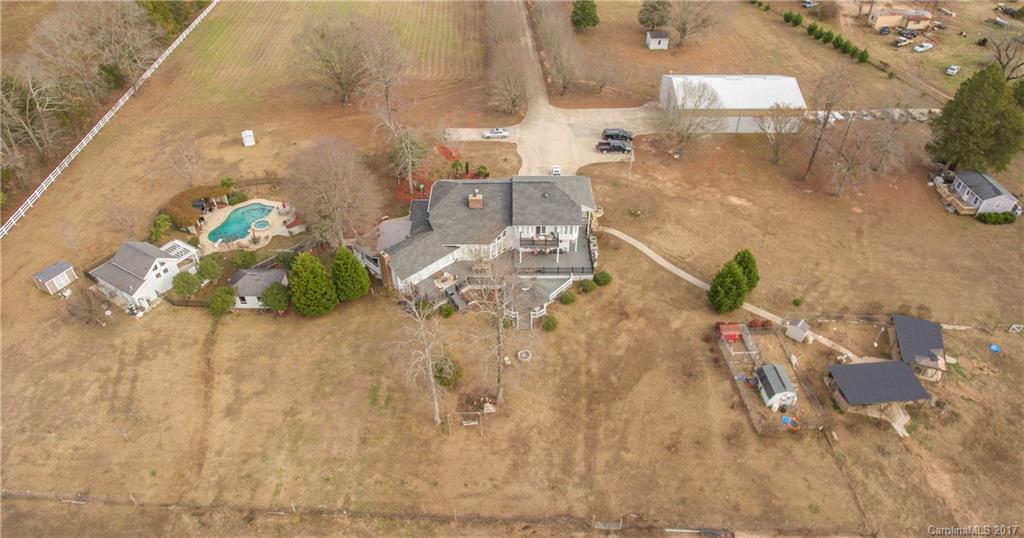 Motivated Seller!!! Private 4,000 sqft Gated Estate on approx 40 acres! Main home has 2 master suites updated kitchen with high end appliances. 4 bedrooms 3 full baths. Entire property is fenced. Perfect property for horse farm complete with pool house and secondary building that features a motor hoist, air lines, lighting, and insulated roof. Possibility to build other homes and/or structures on the property. Additional septic systems already installed.
WILL CONSIDER SWAP WITH HOME IN YORK