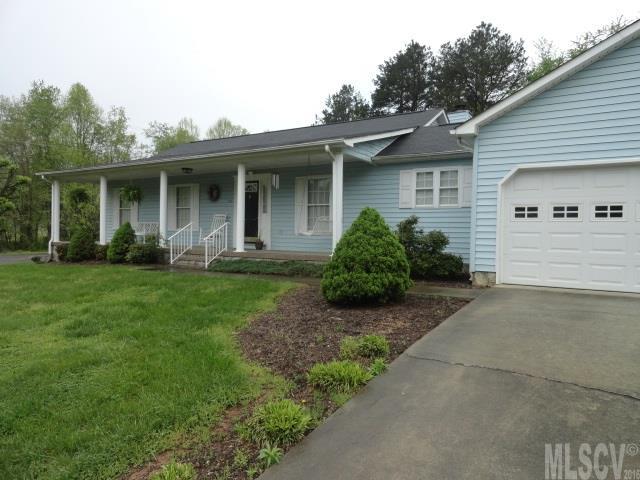Lovely Home!! Curb appeal is great.   Ready to move in. Neutral colors. Nice spacious living room with fireplace and built in shelves. Dining room with hardwood floors. Kitchen is very spacious as well with almost new vinyl. Updated baths. Master has walk-in closets and is a very good sized room. The 2nd bedroom has a walk-in closet as well. Both bedrooms are spacious. Nice rocking chair front porch. Nice poured patio in back. Very little maintenance needed. Roof only 2-3 years old. Water heater replaced 2 yrs ago.  Priced to sell!!! More than $11000 under tax value.