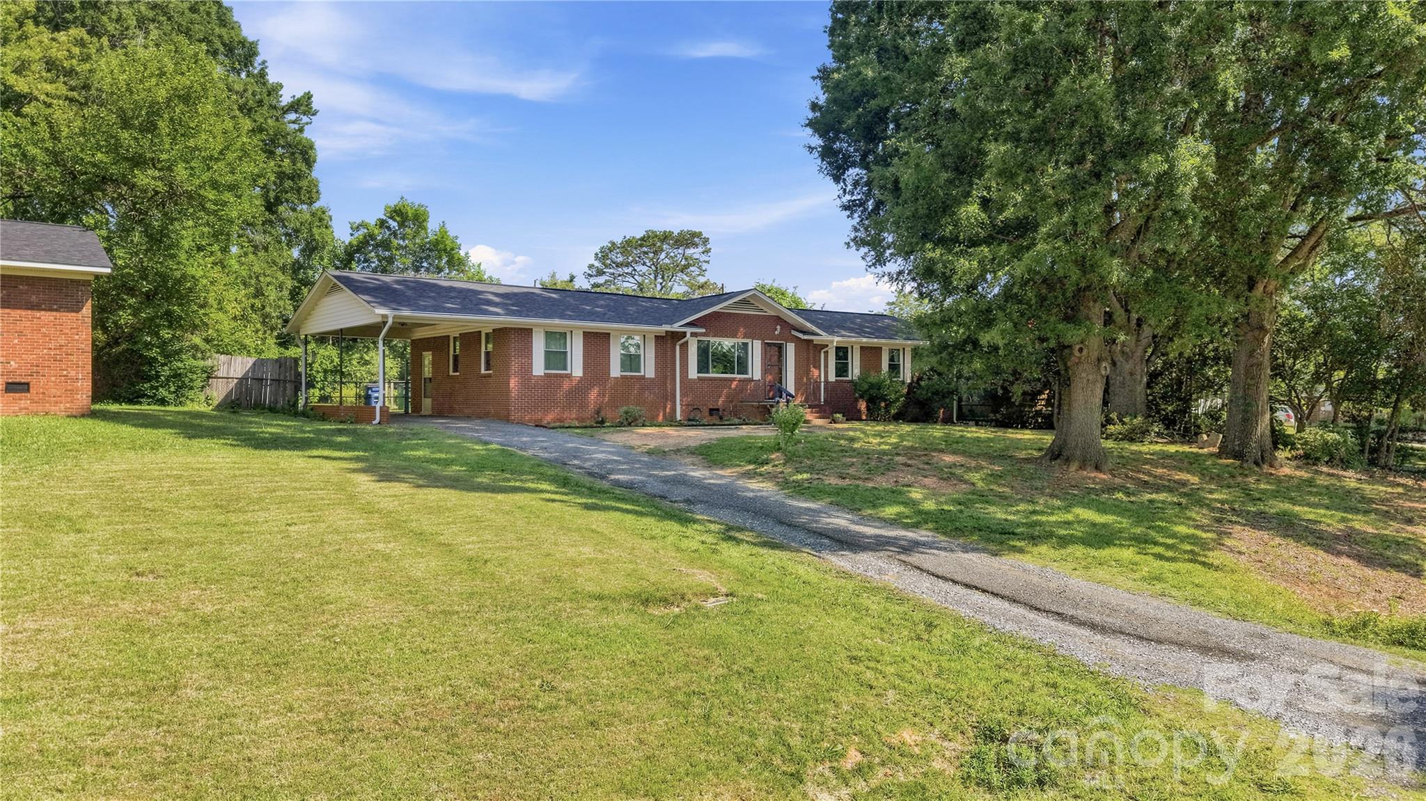Imagine coming home to 323 Meadowbrook Dr, Matthew, NC—a charming 3-bedroom, 2-bath home set on a lush 0.46-acre .This charming ranch-style home features a welcoming attached carport, offering convenient, covered parking and seamless access to the main entrance. Enjoy your mornings in our cozy three-season room, the perfect breezy spot to enjoy your coffee while watching the sunrise over the trees.Hard wood flooring through out the home .Newer roof 2023 .Price Under tax Value.Come enjoy the peace and quiet of the country all within minutes of 485!