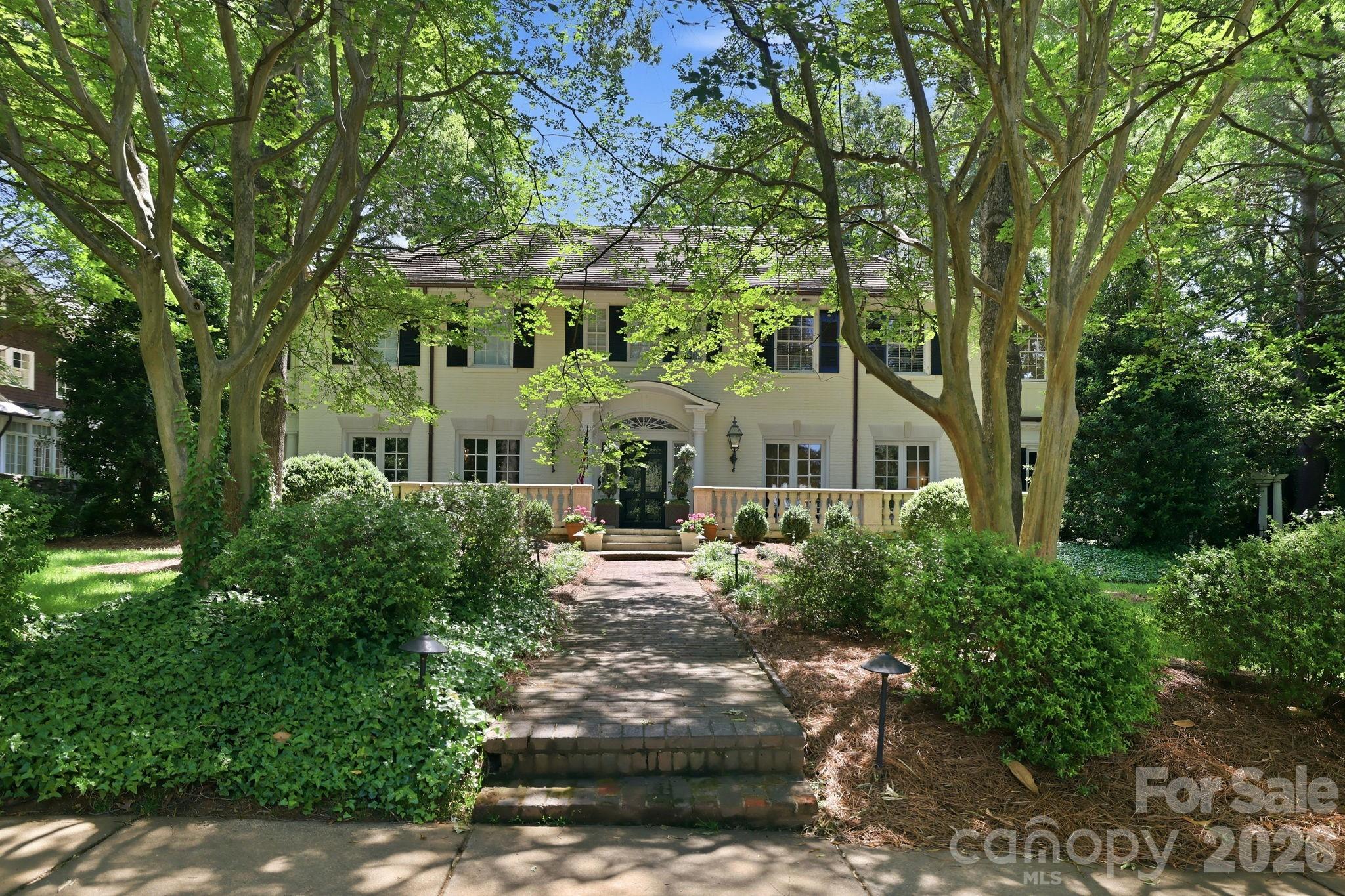 Timeless elegance meets modern comfort in the heart of coveted Myers Park. This stunning 1920s estate showcases exceptional curb appeal, exquisite millwork, and refined architectural details, all nestled along one of Myers Park’s picturesque tree-lined streets.

A breathtaking entrance hall welcomes you with a sweeping staircase, setting the tone for the elegance found throughout. The light-filled Great Room features a beautiful fireplace and French doors opening to the front terrace, creating seamless indoor-outdoor flow and an inviting space for entertaining. Gracious formal living and dining spaces are complemented by a richly paneled study complete with wet bar and powder room—perfect for work, hosting, or quiet retreat.

Designed for everyday living, the home also offers a cozy reading room with casual dining space and a beautifully remodeled kitchen blending timeless style with modern convenience.

Upstairs, the spacious primary suite offers a private sanctuary with fireplace and exclusive access to a rooftop terrace. The luxurious remodeled primary bath features high-end finishes and a private sauna for a true spa-like experience.

Enjoy outdoor living year-round from the covered back patio, while the fully equipped guest apartment above the garage offers incredible flexibility for guests, extended family, au pair, or home office.


A rare opportunity to own a distinguished estate in one of Charlotte’s most sought-after neighborhoods rich in history, elegance and warmth and just minutes from dining, shopping, and all that Myers Park has to offer. This is classic Charlotte living at its finest.