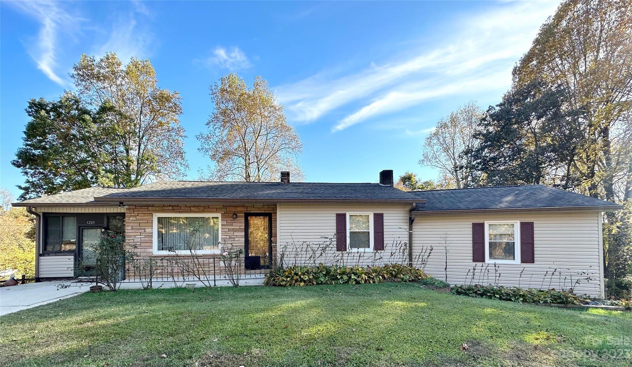 Affordable & Spacious Home Close to Town! Low Maintenance, w/Vinyl Siding, Newer Roof/Guttering, & Replacement Windows! Beautiful flowering perennials, 2 lots providing a large 1.5 acre yard, & a beautiful view of Table Rock! Nice In-ground Pool, w/new cover! Inside find an open floor plan where the living room, w/beautiful hardwood floors, flows into the kitchen. The kitchen has white cabinetry, stainless steel appliances & a double window looking to the back yard pool area! Central Vacuum System! Off the kitchen you'll find a nice sun room w/new vinyl plank flooring & its own heating/cooling source! This floor also has new carpeting, a very spacious laundry room, secondary bedrooms, & a large primary suite! The primary suite has a newer hot water heater for the full bath w/spa tub, & glass doors leading out to a private deck! Downstairs, find a large finished bonus space w/fireplace! There is also a workshop w/woodstove & garage on this level! Hurry to see this affordable home today!