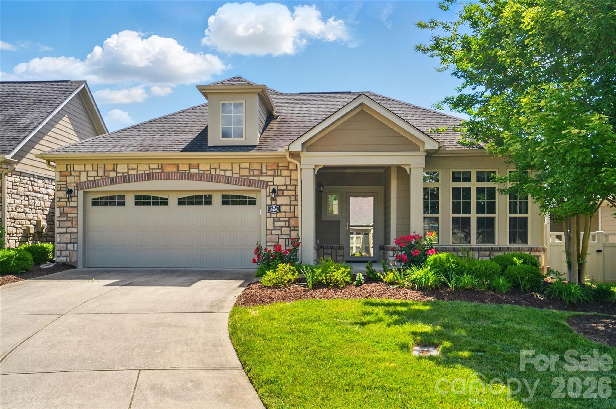 Welcome to Polo Club at Mt. Island, the perfect place to call home! This inviting residence is move-in ready, featuring stunning hardwood floors, nice trim details, and a neutral color throughout. A desirable 55+ gated community offering privacy and low-maintenance amenities. Designed for easy living and aging in place, the primary suite includes a sitting area, walk-in closet, and zero-entry shower. The kitchen is a chef's delight, offering granite countertops, stainless steel appliances, double ovens, a large island, and a skylight for everyday natural light. Enjoy the rare benefit of no full shared walls and relax on your private landscaped patio. Enjoy cozy evenings by the fireplace in the open layout. Plus, the attached garage adds convenience. The primary bedroom is a true retreat with a relaxing sitting room. As part of a secure gated community, you'll enjoy access to a clubhouse, fitness center, pool, and sidewalks. Easy to walk to local restaurants and shopping, Starbucks, grocery stores, and the Riverbend shopping center.