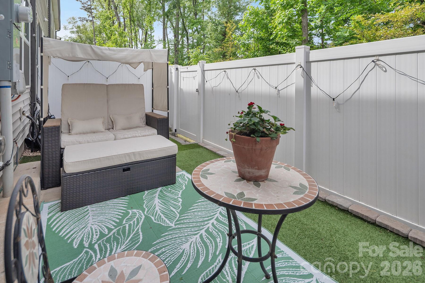 MOTIVATED Seller! One of the best lots in the neighborhood featuring a rare and highly desirable floor plan with two bedrooms plus a spacious bonus room upstairs that can easily function as a third bedroom, home office, or flex space.  Located on a quiet dead-end street, this home offers exceptional privacy with a 6-ft white vinyl fence backing to woods. The backyard has been leveled and upgraded with low-maintenance turf, creating the perfect stress-free outdoor retreat to enjoy from the extended patio or charming front porch. Inside, the open-concept floor plan is ideal for entertaining with durable luxury vinyl plank flooring throughout the main level. The spacious living room flows seamlessly into the large dining area and gourmet kitchen featuring stainless steel appliances, quartz countertops, tile backsplash, deep single-bowl sink, walk-in pantry, and oversized island with seating. The primary suite boasts quartz countertops and a stunning floor-to-ceiling tiled shower with built-in bench seating. Spacious secondary bedrooms and French doors leading into the bonus room complete this exceptional home.  Conveniently located just off the highway with quick access to NoDa, South End, and Uptown, you can enjoy Charlotte’s arts, dining, and entertainment without the hassle of city traffic and parking.