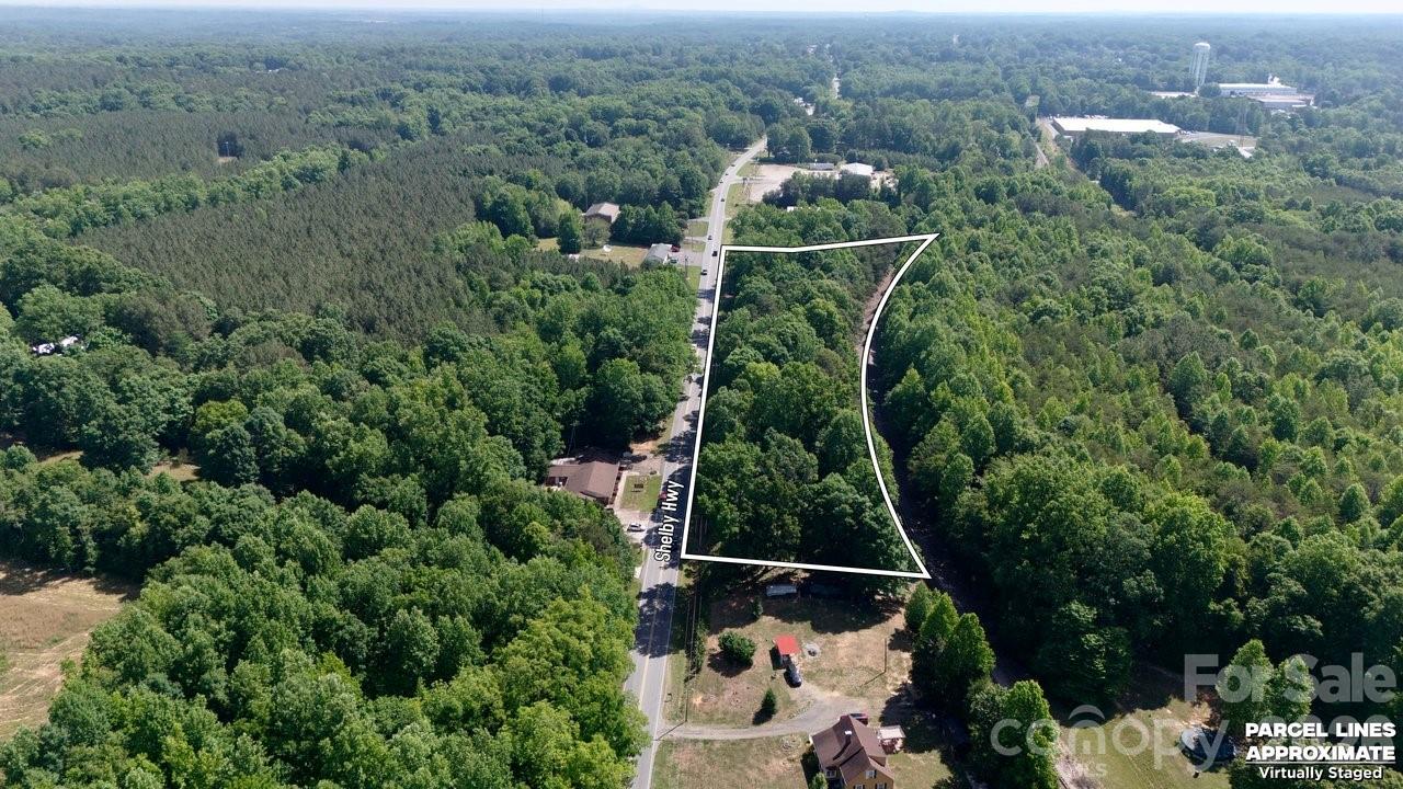 Positioned on over 4.5 acres at the gateway to Cherryville, this exceptional commercial property offers a rare chance to bring your vision to life in a high-visibility location. With outstanding road frontage and a prime position welcoming visitors into the city, the possibilities are endless for a business looking to make a lasting impression. Whether you’re dreaming of retail, dining, entertainment, or a mixed-use development, this property provides the space and exposure to make it happen. A completed survey adds extra confidence as you plan your next venture. Opportunity, visibility, and potential all come together here—Cherryville is ready for what comes next.  A new driveway and clearing has been created. 

This property can be used residentially once rezoned. 

This property is for sale or lease.  For leasing information see agent remarks