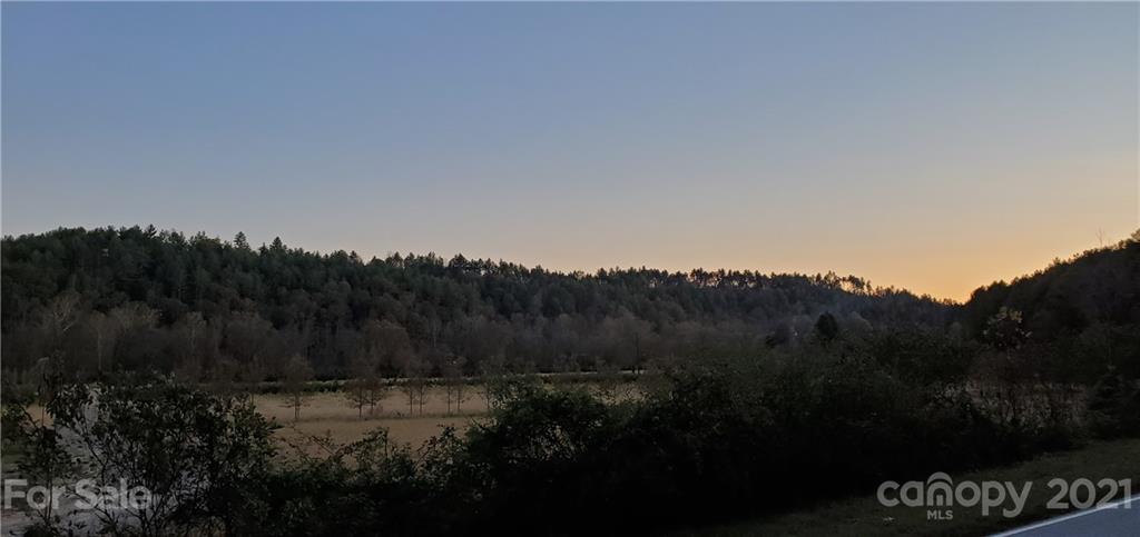 3.6 Acre Wooded Mountain Lot  on Adako Rd - Perfectly located at overlooking pond, manicured tree nursery and the Johns River.  Landscaped Community Entrance with waterfall.  Paved road frontage.  Perfectly nestled at the base of the Blue Ridge Mountains.  Contact listing agent for additional information and showing instructions. CC&R's available upon request.