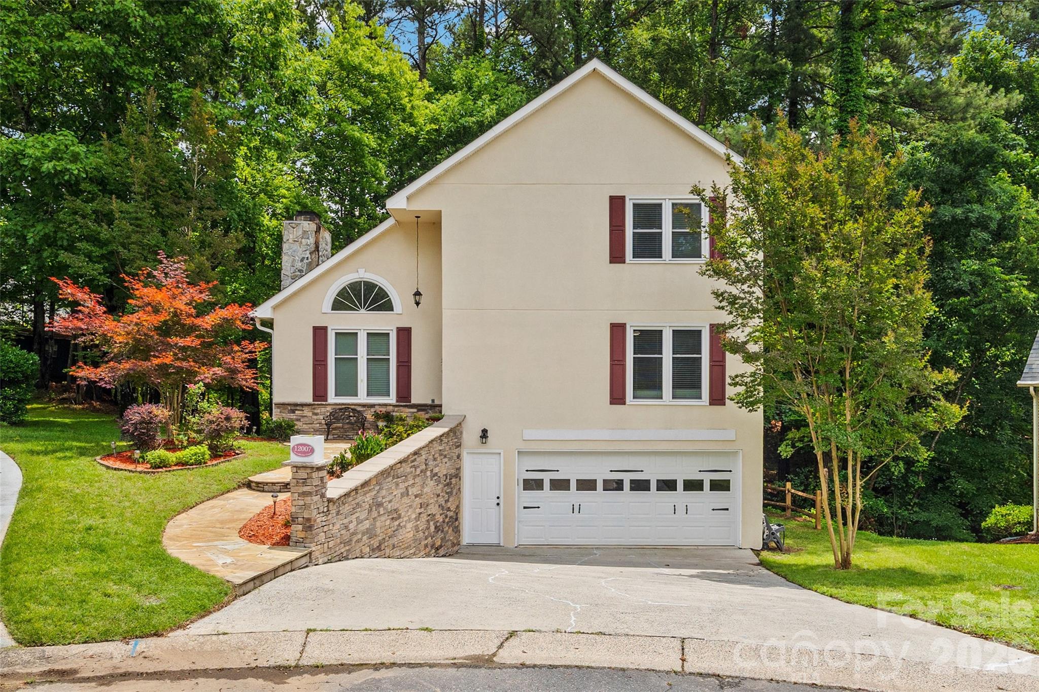 Charming 3-bedroom, 2-bath home nestled on a peaceful wooded cul-de-sac lot in the highly sought-after community of Tega Cay! This inviting home offers the perfect blend of privacy, character, and convenience. Enjoy entertaining friends and family or simply relaxing with nature from the freshly re-painted deck overlooking the serene backyard, complete with a cozy patio retreat.

The versatile walk-out basement flex room is currently used as a bedroom but would also make an ideal media room, home office, game room, art studio, or workout space. The main level features a spacious bedroom currently utilized as an office, along with a full bath for added flexibility. Upstairs, you'll find two additional bedrooms connected by a convenient Jack-and-Jill bathroom.

Recent updates include new flooring, fresh interior and exterior paint, updated lighting fixtures, and more, making this home move-in ready. Additional features include a garage with extra storage space and plenty of room for all your outdoor gear and hobbies.

Located in the heart of historic Tega Cay, residents enjoy access to an incredible lifestyle featuring Lake Wylie, golf courses, tennis courts, parks, walking trails, the beach club, and a variety of community events. Conveniently situated within the award-winning Fort Mill School District and just minutes from shopping, dining, and major commuter routes, this home offers the best of both tranquility and accessibility.

Don't miss this opportunity to own a charming retreat in one of the area's most desirable lake communities!