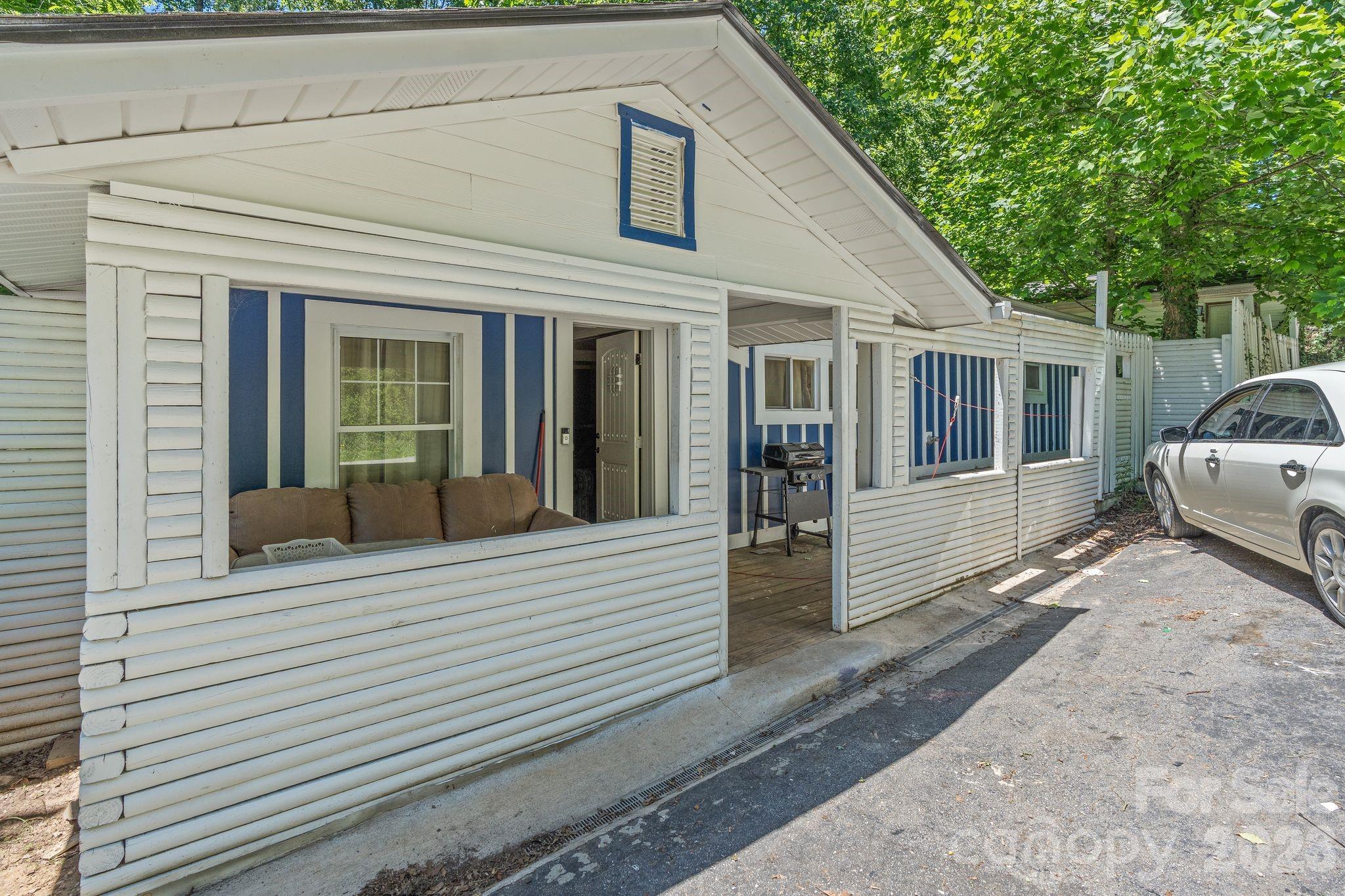 Investor special in Candler! This 2-bedroom, 2-bath home offers a unique opportunity for investors, renovators, or buyers looking to take on an improvement project. Conveniently located just minutes from Asheville, the property features a detached garage, off-street parking for two vehicles, and a layout with potential for renovation and value enhancement.

The home is being sold as-is. Existing decks are in poor condition and should be used with caution. Buyers are encouraged to conduct their own inspections and assessments.  Trailer does not convey.