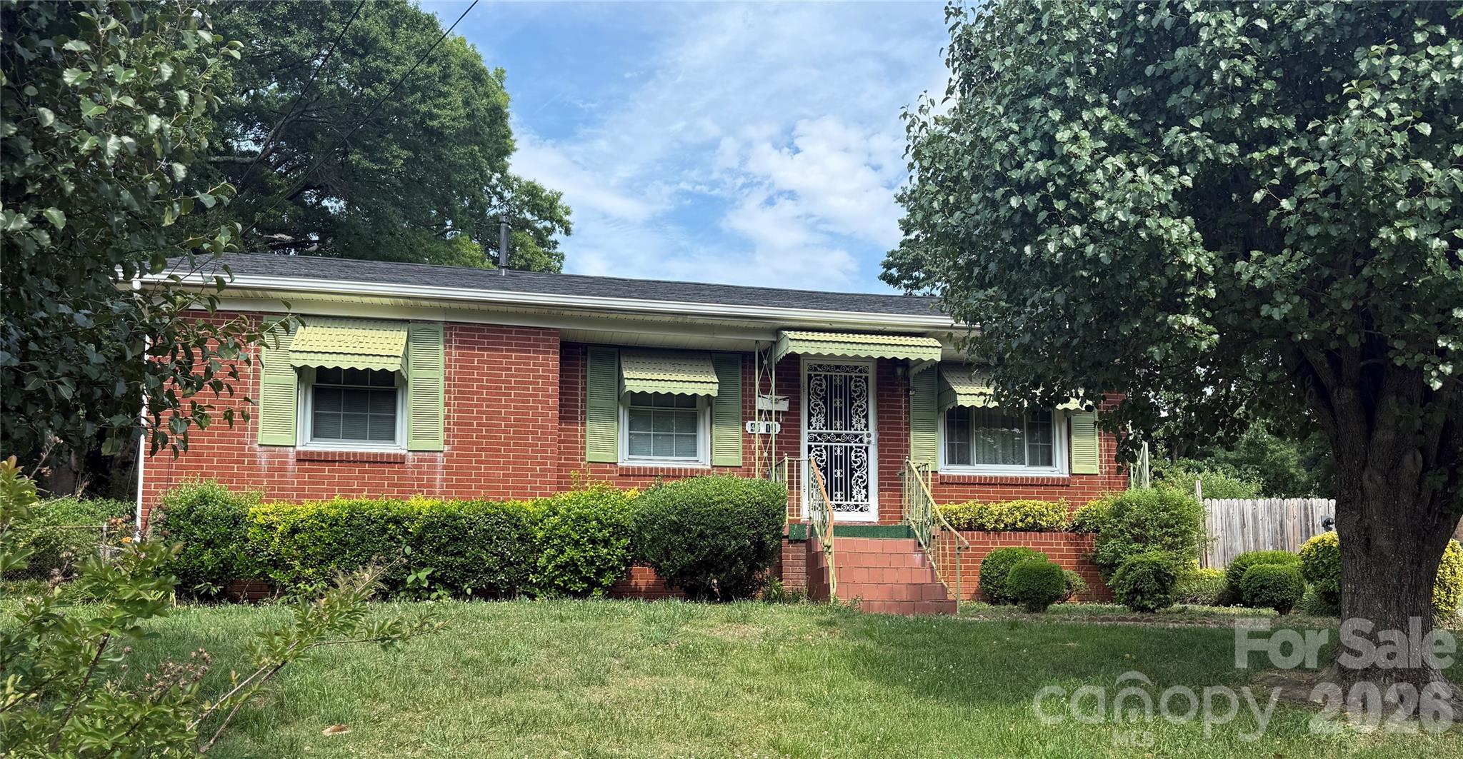 Charming full-brick ranch featuring both a spacious living room and a cozy den with fireplace. Hardwood floors are believed to be under the carpet, offering great potential to restore the home’s original character. Ready for your personal updates and improvements, this property is a fantastic opportunity for investors or homeowners alike.  See it today before it's gone!