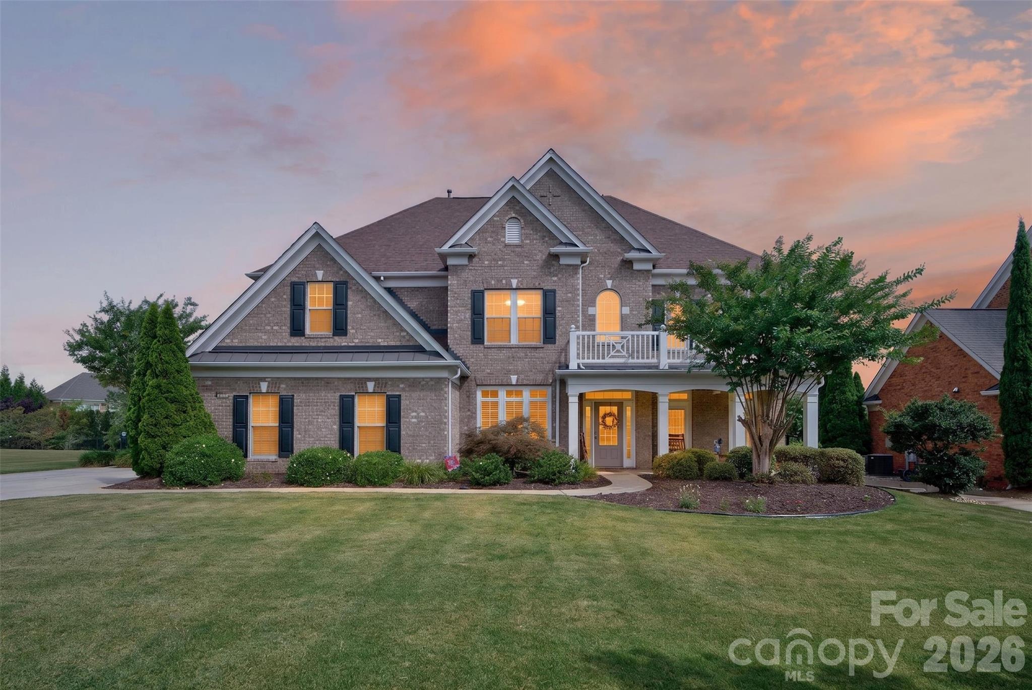Nestled on a quiet cul-de-sac and within walking distance of Sandy Ridge Elementary, this stunning all-brick, three-story home offers exceptional space, style, and amenities. The main level features a private office/study, elegant formal dining room with a butler's pantry, and a spacious family room with a gas fireplace that opens seamlessly to the gourmet kitchen. Designed with the home chef in mind, the kitchen boasts a large center island, five-burner gas cooktop, built-in GE refrigerator, and abundant workspace. Rich 5-inch cherry hardwood floors and extensive custom moldings add warmth and sophistication throughout the main level. Upstairs, the expansive primary suite provides a relaxing retreat with a generously sized bath. Three additional bedrooms each enjoy convenient access to a full bathroom. The third floor offers incredible flexibility with a sixth bedroom or second bonus room, complete with its own full bath. Step outside to enjoy the beautifully maintained backyard featuring a large paver patio, built-in firepit, level fenced yard, and plenty of room for entertaining or play.
Additional highlights include a three-car garage and an oversized driveway with ample parking. Residents of Chimneys of Marvin enjoy outstanding community amenities, including a Junior Olympic pool with water slide, toddler pool, tennis courts, pickleball courts, basketball courts, sand volleyball court, recreation field, scenic walking trails, and a picturesque neighborhood pond. Located just minutes from award-winning Marvin Ridge Middle School and Marvin Ridge High School, this exceptional home combines luxury, convenience, and an unbeatable location.
