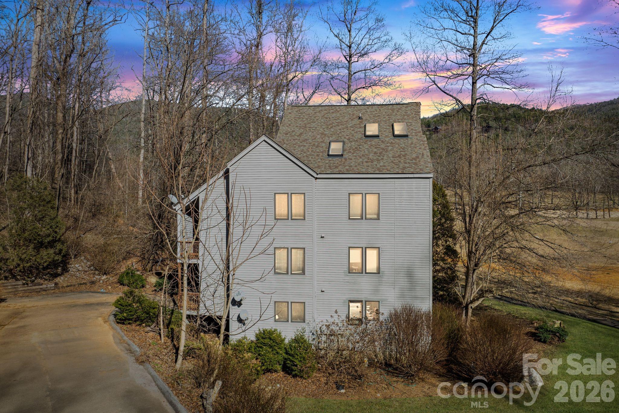 Experience mountain living at its best in this 3 bedroom, 2 bathroom, 1.5 story top floor condo located in highly desirable North Cove Valley. Ideally situated just minutes from Linville Falls, the Blue Ridge Parkway, and Linville Falls Winery, this property offers both convenience and year round natural beauty. The open concept living and dining area provides a comfortable, versatile layout perfect for relaxing or entertaining. Step onto your private deck and enjoy gorgeous mountain views, the perfect backdrop for morning coffee or unwinding after a full day in the mountains. Additional features include an in unit washer/dryer, convenient parking, and easy access to community amenities. Outdoor lovers will appreciate having a professional disc golf course and scenic walking areas along the North Fork Catawba River right outside your door. This peaceful, well kept community is known for its mountain scenery and excellent investment appeal. The seller is offering a buyer credit covering the first year of HOA dues, adding exceptional value. Short term and long term rentals are allowed, ideal for investors seeking immediate income. A rare opportunity to own a spacious, low maintenance mountain property with outstanding views, amenities, and rental flexibility in one of the area’s most sought after communities.