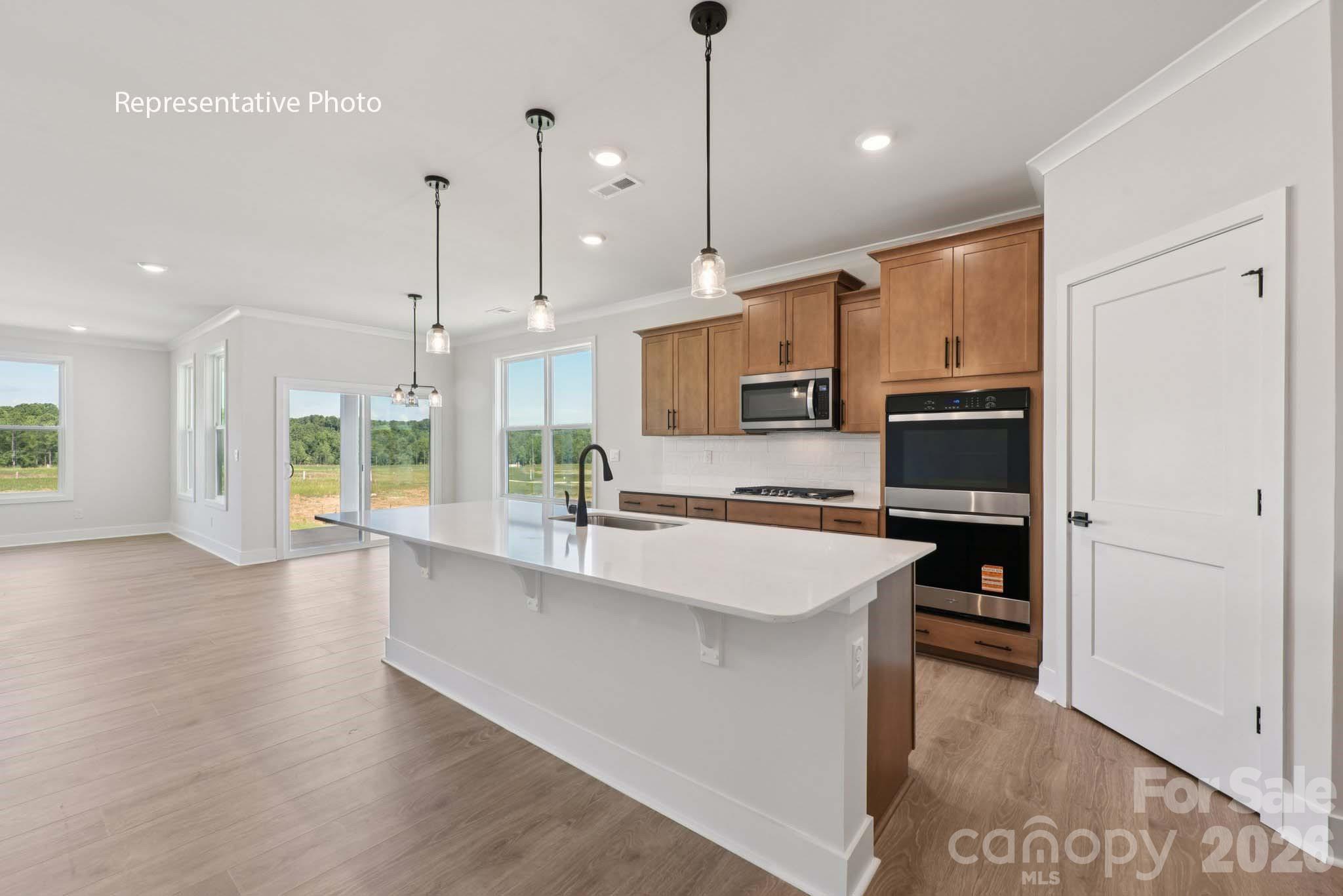 Check out 2219 Keppel Court in Westport in York, SC.

The Hartwell is a two-story home offered at Westport in York, SC.
This modern two-story home offers four bedrooms, including two on main level, loft, as well as three bathrooms and a two-car garage.

As you step onto the porch and into the home, you’ll be greeted by an inviting foyer and a bedroom that could also be perfect for a home office. It then opens up to a spacious kitchen, dining and family room area. The chef’s kitchen is equipped with stainless steel appliance, large granite countertops with tile backsplash, ample storage space, a pantry, and a kitchen island. The primary bedroom is also on the first level offering privacy as well as an en-suite bathroom with a soaking tub and shower, and large walk-in closet.

Upstairs the additional two bedrooms provide comfort and privacy for every household member long with a bathroom and spacious loft area.

With its thoughtful design, spacious layout, and modern conveniences, the Hartwell is the home for you at Westport in York, SC.

All this and a large pool, clubhouse to come and only a few minutes to Lake Wylie boat ramp and park.