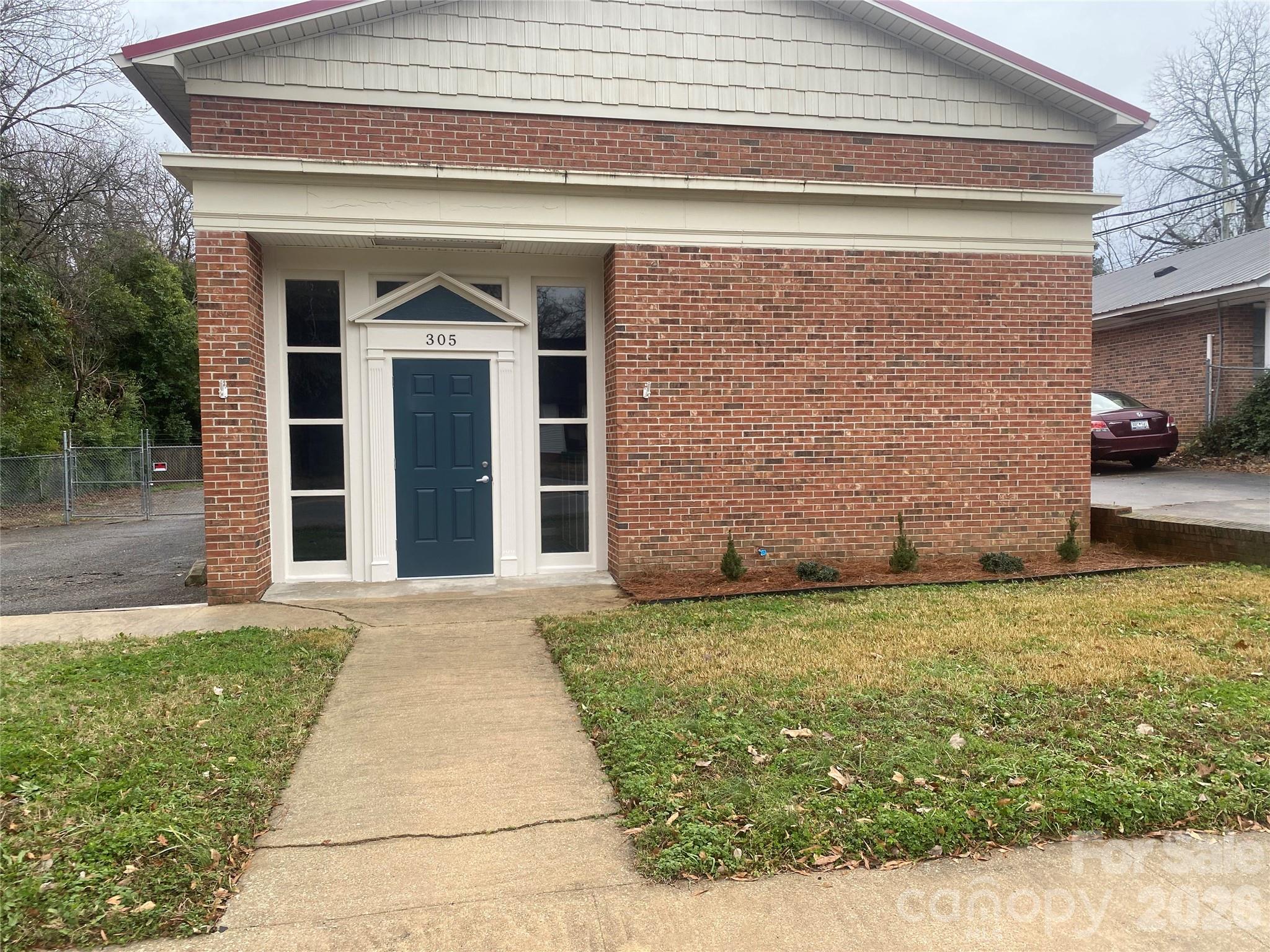 Zoned B-2, Neighborhood Commercial, zoning would allow property to be occupied as a residence and operate a business also, Attractive, low maintenance building. Brick veneer, metal roof, Reception area, 2 offices freshly painted, 2 rest rooms, 867 square feet open area for storage or divide for additional offices. Partially fenced parking area at rear of lot. Heat pump & water heater 7 years old. 200 Amp Svc,220 receptacles available. Handicap accessible, 15 parking spaces beside building additional spaces at rear of building.  Owner will consider leasing.