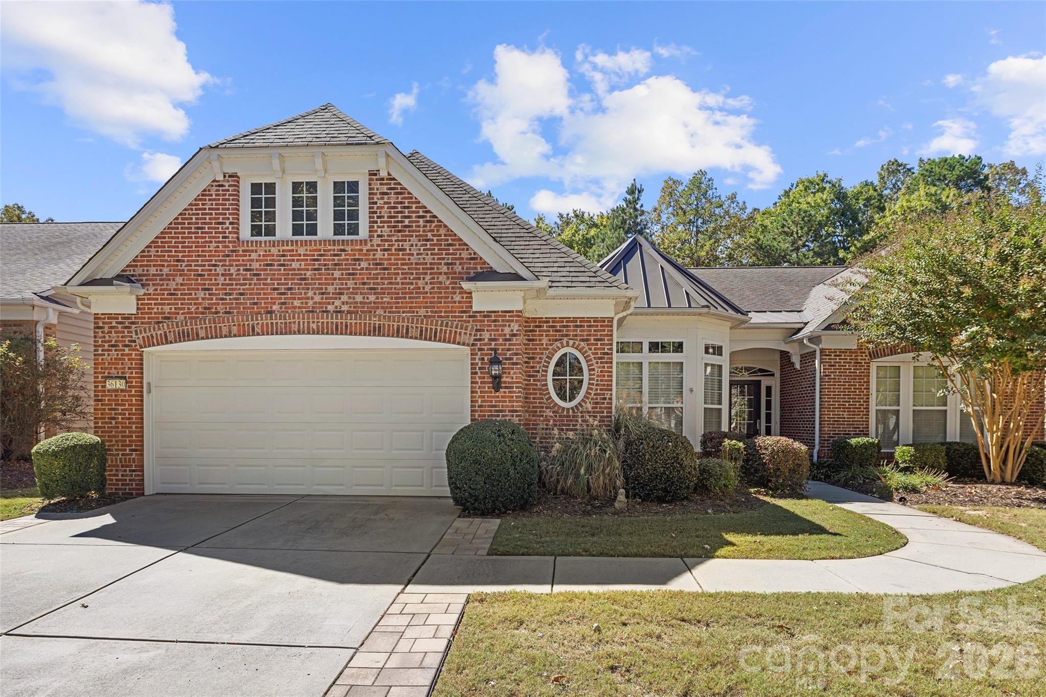 Private, wooded views overlooking the 15th fairway define this exceptional homesite in Sun City Carolina Lakes. This well-maintained Cumberland Hall floor plan offers easy single-story living with 3 bedrooms and 2.5 bathrooms. 
The open-concept design is filled with natural light, anchored by a spacious great room with a gas-log fireplace. The adjoining dining area flows effortlessly into the well-appointed kitchen, featuring a center island, breakfast bar, gas cooktop, and wall oven.  
The primary suite offers a peaceful retreat with a tray ceiling and spa-like bath, including a walk-in shower and separate garden tub. A split-bedroom design ensures privacy for guests, while a dedicated office adds flexibility. Wood and tile floors run throughout the house. 
Enjoy outdoor living from the screened porch and paver patio, perfectly positioned to take in the private, wooded golf course setting.
Notable upgrades include new ceiling lights in the living room, closets, & garage, as well as a widened driveway. 
Additional features include a radon mitigation system, an attractive partial brick facade, a two-car garage with spacious storage cabinets and a bump-out for golf cart, and an in-ground irrigation system. 
Resort-style amenities include clubhouses, indoor and outdoor pools, fitness center, tennis and pickleball courts, 
and a vibrant, active lifestyle.