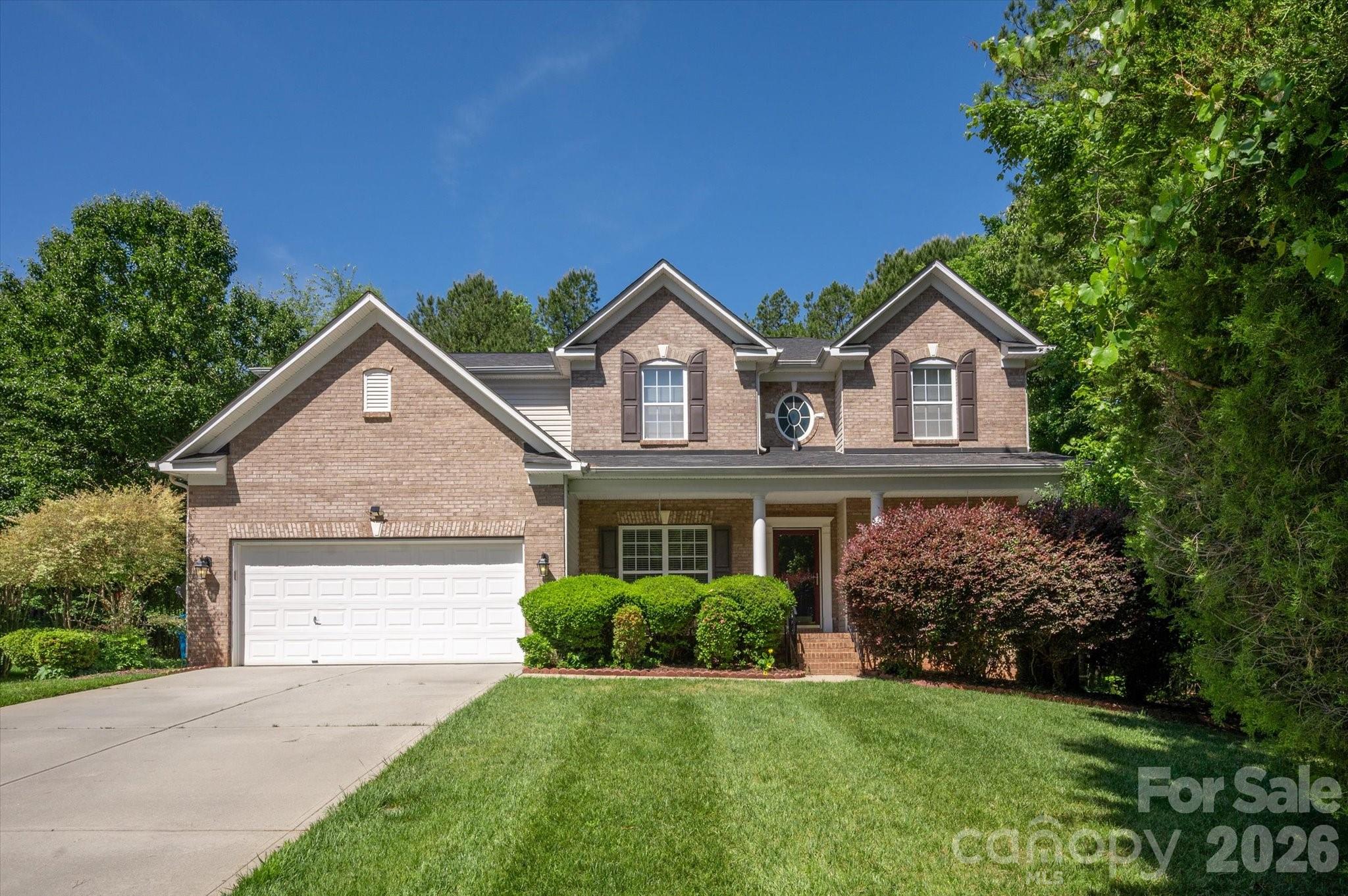 Beautiful home located on a private .74 acre cul-de-sac lot in the Marvin School district with nearly 2,900 square feet of tasteful features such as high ceilings, an open concept living area, primary on main, and more. Main floor features a dedicated office with French doors, a formal dining room with tray ceiling and crown molding, and a spacious two-story great room with a fireplace.  Kitchen features an abundance of cabinetry, granite countertops, stainless steel appliances, bar seating, and a walk-in pantry.  The kitchen opens to a comfortable breakfast area that opens to the screened porch. Also on the main floor is the spacious primary suite, which features hardwood floors, a tray ceiling, and an en suite bath with a double sink vanity, separate shower, soaking tub, and a large walk-in closet. The second level offers three secondary bedrooms, a full bath, and a large bonus room that works well as a media room, playroom, or optional fifth bedroom. 
Outdoor living includes a screened porch that opens to a deck overlooking the private backyard with mature trees. Zoned for top-rated Marvin schools and conveniently located near shopping and dining, this home is a great opportunity in one of the area’s most sought-after locations.  Only 5 mins to downtown Waxhaw!