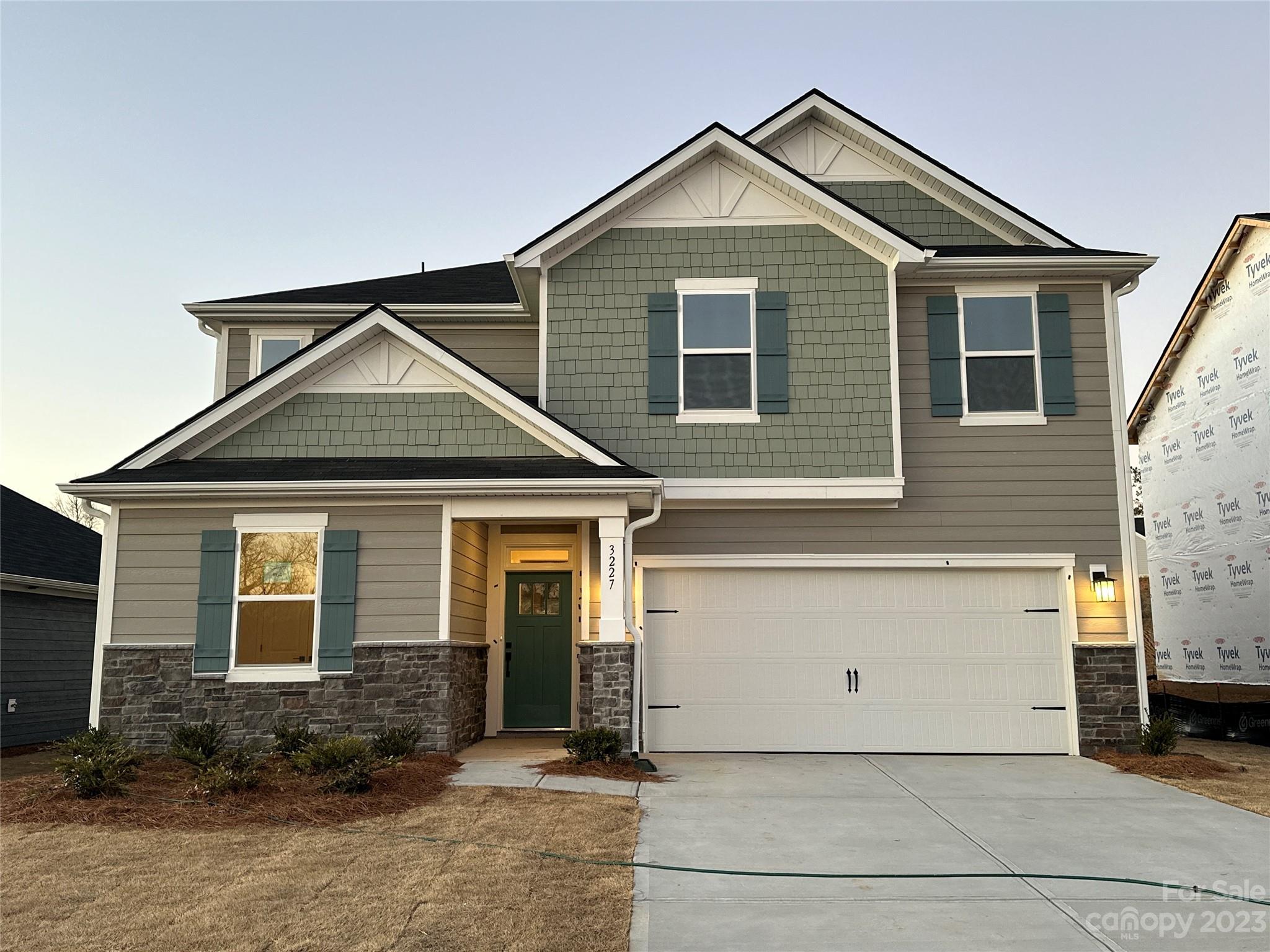 MOVE IN FEBRUARY 2024!  This fantastic home with cement siding and stone masonry is now being built just for you and will be ready in Feb/Mar 2024.  GORGEOUS HOMESITE!  Bella Vista is a gorgeous community, located in the growing area of Denver, NC, with close proximity to all major freeways including I-77 and I-485, is set with rolling hills and a unique and pristine landscape.  This beautiful 2 story home with 5 bedrooms, 3 baths and large open plan with family room, kitchen, dining room and guest bedroom on the main floor is perfect. Upstairs you will find a spacious owners suite with a large separate walk-in closet and private primary bath with walk-in tile shower as well as three guest bedrooms, full guest bathroom, large loft for entertaining guests and family and the laundry room.  Prepare to enjoy your wonderful rocking chair extended rear patio area also great for grilling after a long day.  Don't wait any longer to call Bella Vista home.