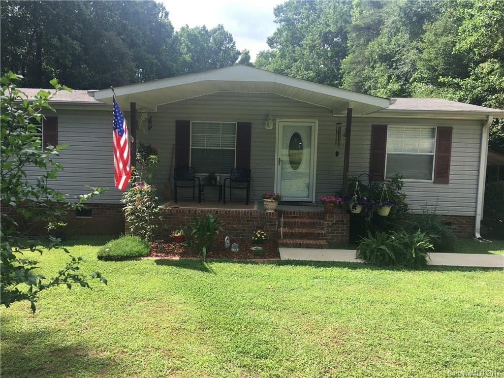 Want to Escape the HOA Debacle? This Spotlessly clean, move in ready, Palm Harbor home on 1.72 acres is a must see! Enjoy country living close to the city: great location, less than a mile from the NC/ SC border and only a couple miles from Carolina Place Parkway Mall, Less than 10 minutes from Ballantyne, easy access to I-77 and HWY 485. Privacy and serenity & meticulously maintained = higher quality of life. 
 Also see MLS 3276571 where property is offered for potential development.