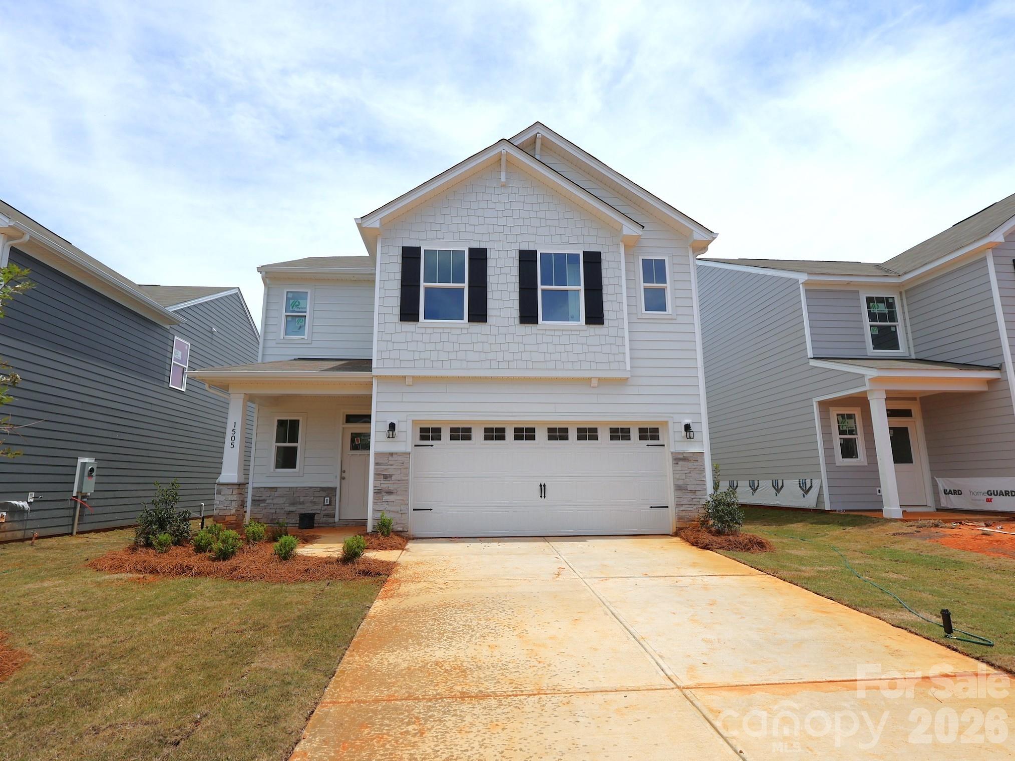Welcome to the Bartlett! Walking in from the front covered porch you are greeted with a warm and inviting foyer. The home opens up into your kitchen, family room and breakfast area. You'll notice the main areas of this level have been finished with easily maintainable EVP flooring and throughout the home the windows have been accented with 2" faux wood blinds. The kitchen is fit for a chef, featuring stainless steel appliances, a French door refrigerator, quartz countertops and an island with a sink. The family room is spacious and allows for conversation to flow easily. Through the sliding glas door is an extended patio, perfect for entertaining or enjoying a morning coffee. Heading upstairs, you'll find a spacious loft, perfect for an extra living space or game room. There are two additional bedrooms and a full shared bathroom with a dual vanity and separate toilet and shower area. The laundry room has been centrally located and includes a full size washer and dryer. Finally, walking into the Owner's suite you'll find plenty of natural lighting and enough room to accommodate a king size bed and other furniture. The en-suite is straight from a spa featuring a tiled shower, dual vanity and private toilet area. Finishing the suite is a spacious walk-in closet that is sure to fit any size wardrobe. Welcome to your new home!