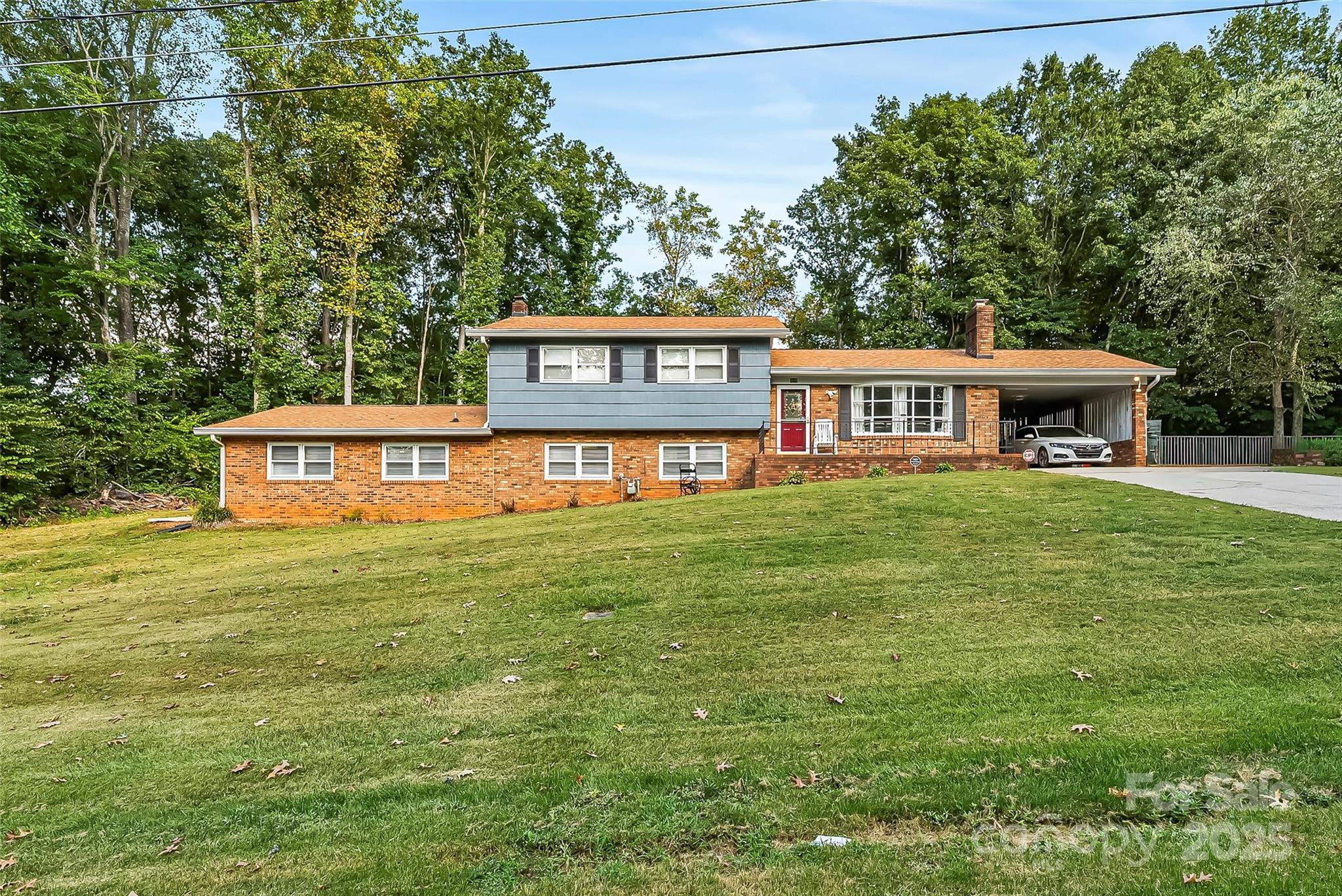 This beautifully updated tri level home offers the perfect balance of space, style, and outdoor enjoyment. Featuring 4 bedrooms, 2.5 baths, and approximately 2,600 square feet, it sits on a 1.02 acre lot designed for both relaxation and entertaining. Step inside to find a bright living room with fireplace, an updated kitchen with white cabinetry, tile floors, stainless appliances, and a center island, plus multiple living areas including a spacious lower level with fireplace and bonus room. Outside is where this property truly shines as sellers just painted the exterior for a fresh finish and gave the pool deck a modern new look. The in ground pool is fully surrounded by a brand new privacy fence, creating a resort style retreat right at home. With a carport, extended driveway, and mature trees offering shade and privacy, this home combines practicality with charm. A rare find in Conover, it brings together thoughtful updates, inviting spaces, and an outdoor retreat ready to be enjoyed!