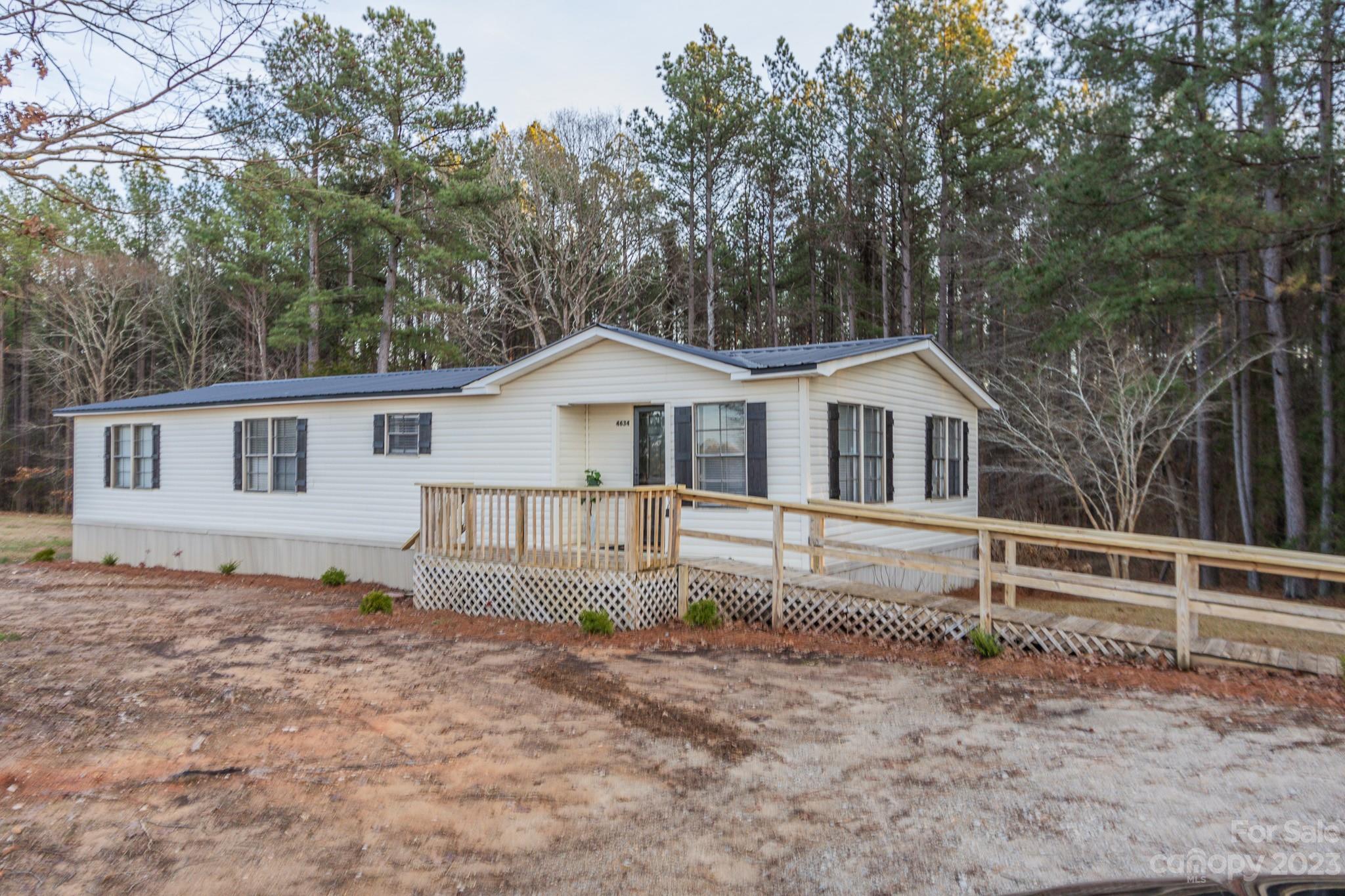 Quiet ,serene, country living describes this Buford property just waiting for you to call it HOME. Three bed, two bath manufactured home with 1419 sq. ft. and sits on just under an acre of land. The home has been refreshed with many beautiful upgrades to include new metal roof, paint, flooring, rear deck, countertops, kitchen cabinets, HVAC and moisture barrier. Enjoy Spring, Summer and Fall evenings on the front deck. Don't miss out on this Buford property. Call today for your private showing.