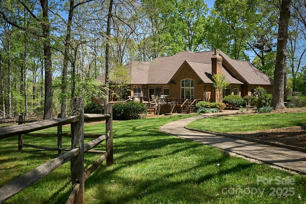 Magnificent 20-acre horse farm nestled in one of the most premier equestrian communities is perfect for horse enthusiasts. Park-like setting provides an ideal environment for both horses and their owners. Main level of the home features a formal dining room, living room, & study. Elegant kitchen appointed with upscale appliances. Primary suite includes a sitting area, luxurious bathroom & custom walk-in closet. 2nd primary suite on the main level also features an en-suite bathroom. Add'l 3 BR, 2 BA, entertainment room, & family room complete the fully finished lower level. Center aisle barn boasts 4 stalls and includes a spacious tack room, large equipment garage, & heated/cooled workshop. Add’l 2 stall run in. The pièce de resistance is the apartment over the barn, beautifully designed with exquisite details that leave a lasting impression. Scenic trail leads between the paddocks and along woods to private, large outdoor arena. Eligible for CETA trails. No HOA! 14 minutes to TIEC!