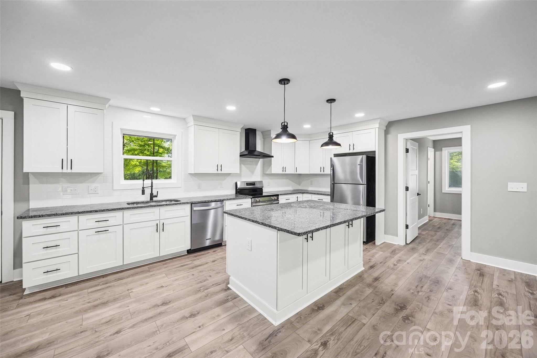 Completely updated on almost 2 acres of potentially subdividable land and just minutes from Lake Wylie access.  NEW roof, NEW HVAC, NEW Water Heater, NEW plumbing, NEW wiring, NEW lighting, NEW floors, NEW Kitchen, NEW appliances, NEW Doors, NEW Well pump, casing & holding tank. NO City Taxes! Create a multigenerational homestead or live in the renovated home and build an investment income producing property on the land.  It is all up to you and your imagination! Fantastic Clover Schools