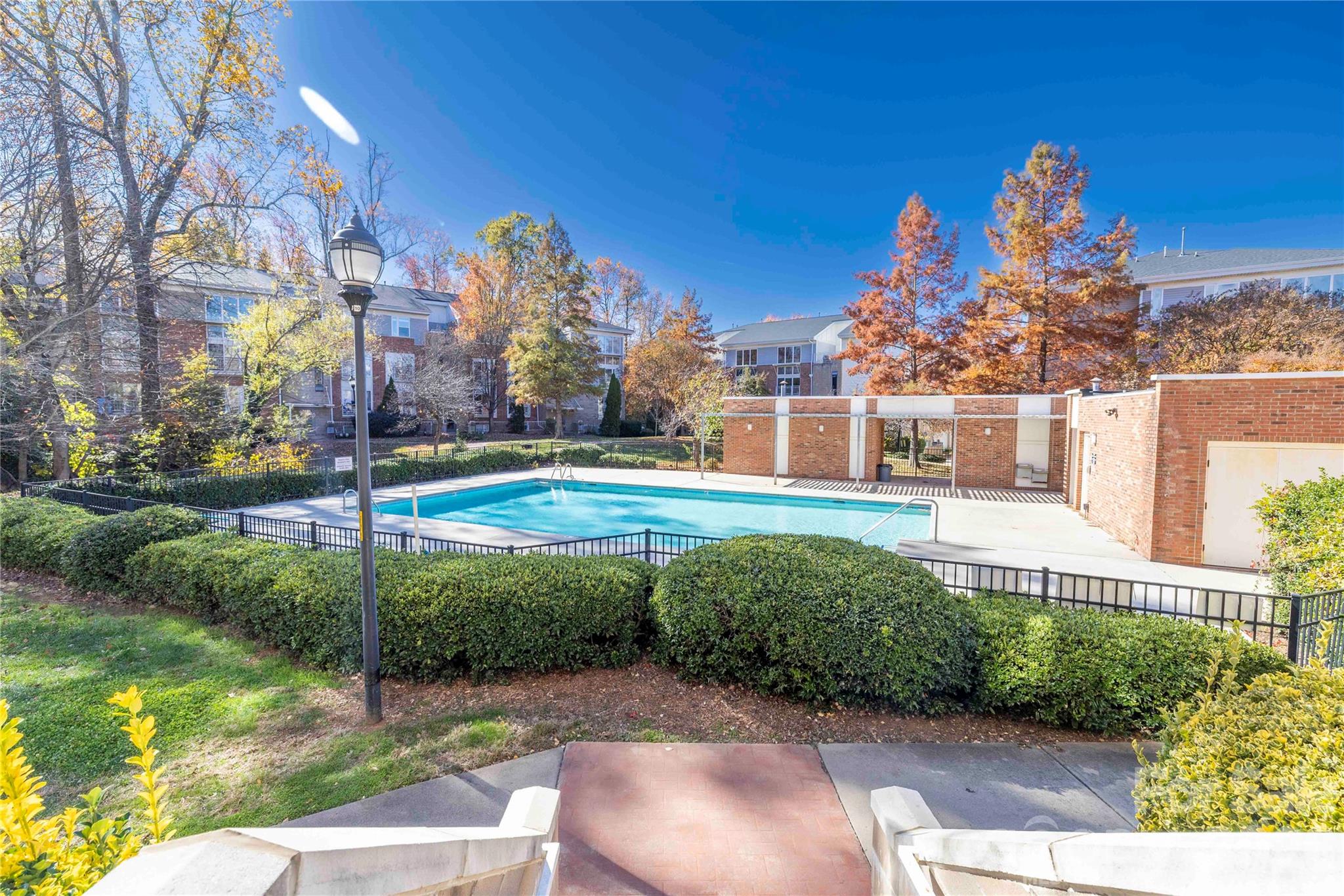 Newly updated kitchen with granite countertops, stainless steel appliances, and new stainless kitchen sink and faucet! Nestled centrally within the community, with access to greenspace, community grills, and picnic tables just outside your door. Slide open your living room door to a Juliet balcony and enjoy a view of the pool that feels like your own private backyard pool – without the maintenance! This 2 bed/2 bath condo is quiet and peaceful both inside and out and flooded with natural sunlight throughout the day.  Spacious bedrooms with an open floorplan living space make this condo feel like home! Conveniently located to shops, restaurants, bars, breweries, distilleries, entertainment and more in the exciting and eclectic NoDA area of Charlotte!