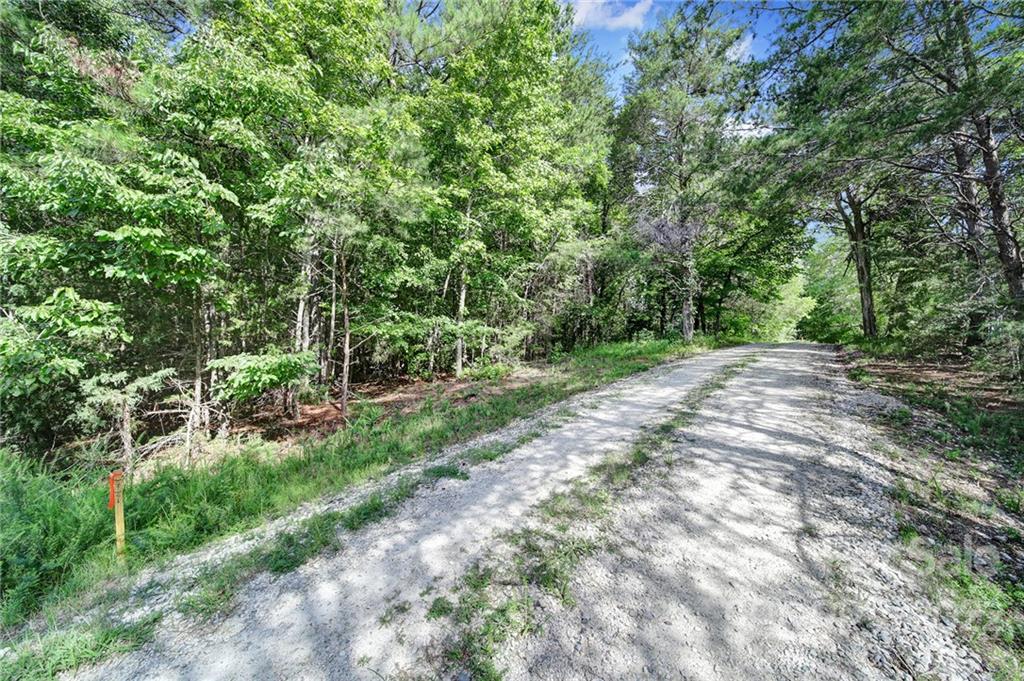 Been dreaming of a homesite or prime hunting land with ample acreage and privacy on a quiet country road? This is 1 of several lots available with R2 zoning and minimal restrictions. It is raw land that that has been perc'd for 4 bedroom septic. Located within 10 minutes of the upcoming whitewater center and national state park in Great Falls.