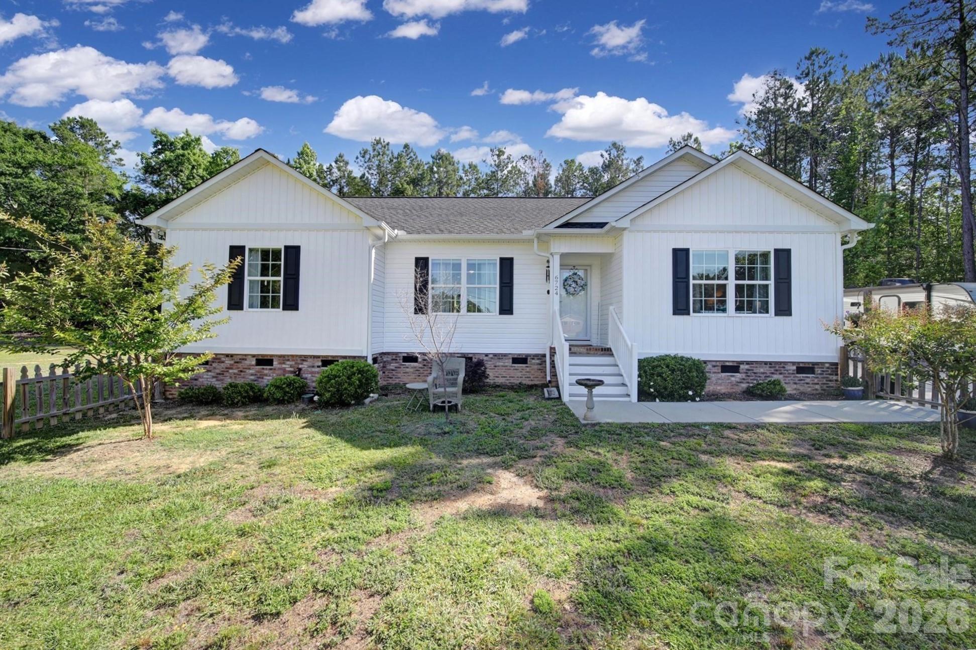 Imagine coming home to space and the kind of peace you would not expect to find in the city limits. Nestled on 1.86 acres on a corner lot, this inviting property gives you room to breathe, grow, and truly enjoy everyday living.

Step inside to a thoughtfully designed split floor plan with 3 bedrooms and 2 baths—perfect for creating your own retreat while still staying connected to family and guests. The kitchen, complete with all appliances, is ready for everything from quiet morning coffee to hosting friends.

Outside is where this property really shines. Picture evenings on the deck overlooking your fenced backyard, kids or pets playing freely, and weekend projects or hobbies coming to life with your 12x20 storage building and spacious 22x24 metal garage.

Whether you're looking for a little more elbow room, a place to entertain, or simply a slower pace of life, this home offers the freedom to live the way you’ve been dreaming.
