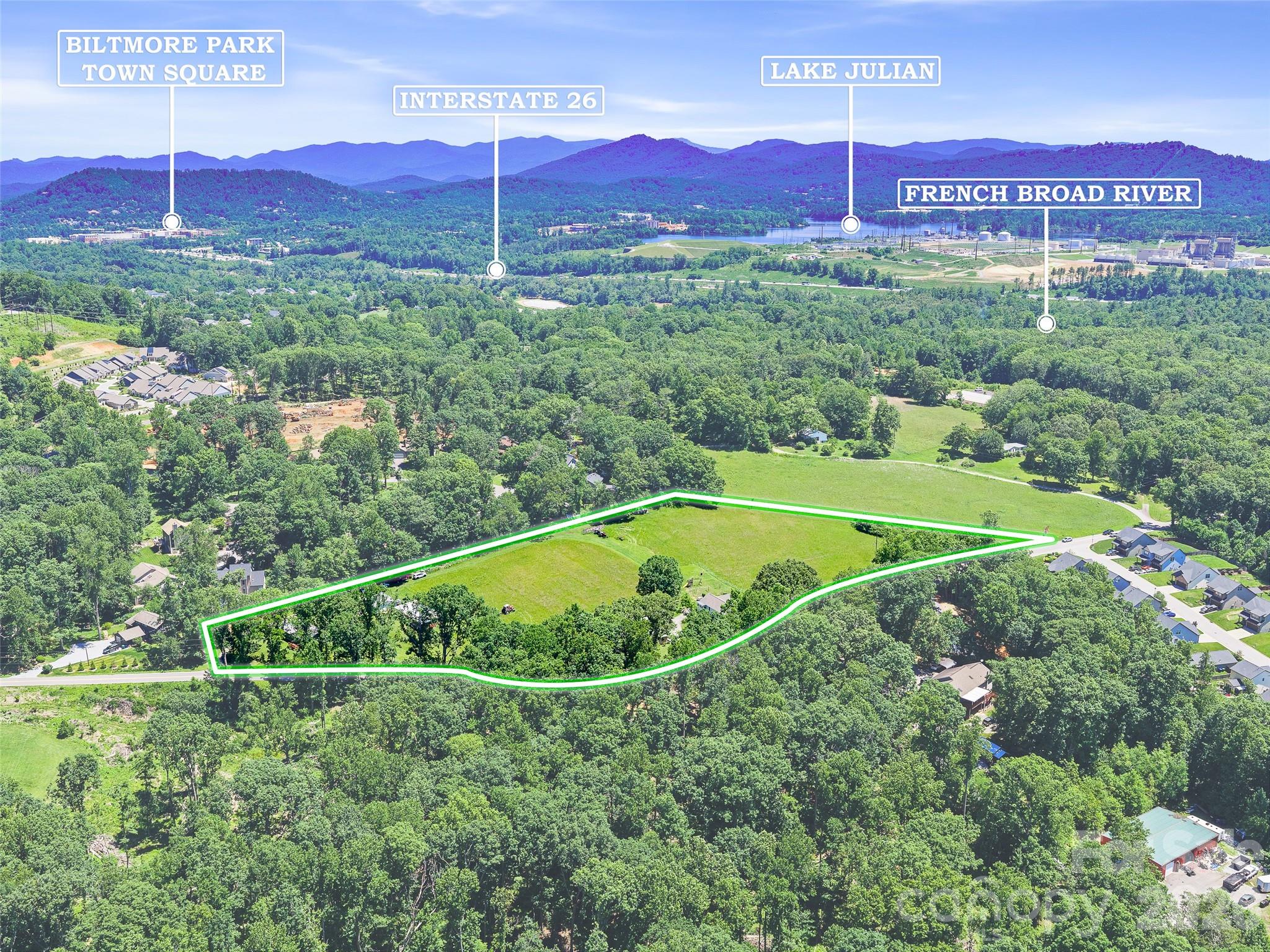 Generational property offers nearly 7 acres of beautiful picturesque rolling hayfields with gentle
pastoral topography perfect for homesteading, farming, or residential development. Passed
down through the generations, this land is now ready for its next chapter in a highly desirable
location. Features a preserved farmhouse alongside two additional dwellings, masonry garage,
wooden shed/workshop-out building making it the ultimate compound, income-producing estate
or private retreat. Conveniently located near the Asheville Airport, local shopping, restaurants and attractions. This property combines peaceful rural charm w/ easy access to Interstate 26. Surrounded by R-1 &
EMP zoning permitted uses include: Single family homes, duplexes & residential development,
Bed & Breakfast, Healthcare Facility, Gym/Nature.Outdoor Recreation, Church/School or
Library, verified with Buncombe County. Max density allows up to 12 dwellings per acre (subject
to county approval) Pre-existing utilities in place including Power, Well(s), and Septic making
subdivision or re-combination straightforward. There is no ROW through the property. Verify
septic & building guidelines with the county. A versatile tract is ideal for building a dream home, expanding, creating an income producing property, or developing a community-oriented project. Surrounded by the countryside beauty, this farmhouse is ready for you to call home. RARE opportunity to own generational land in a
prime growth area.