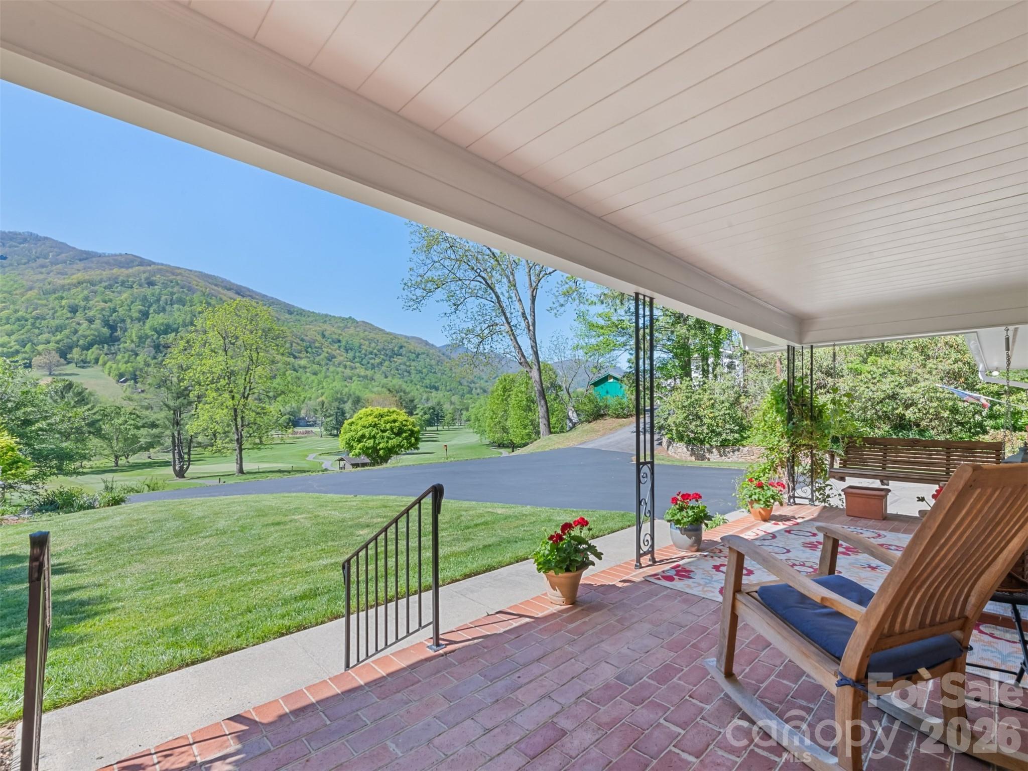 Enjoy stunning mountain views and an envious setting overlooking the front 9 holes of Maggie Valley Country Club Golf & Resort from this beautifully updated property designed for comfortable living, entertaining, and income potential. Located right on the 3rd tee with quick access to the course. FULLY updated and remodelled in 2016-2025. The main home features red oak hardwood and ceramic floors, and a spacious kitchen with quartz countertops, island, pantry, stainless appliances, gas stove. The vaulted ceiling great room includes a gas log fireplace, windows with impressive views, and recessed lighting, laundry room, 2nd bedroom, and BONUS room. The luxurious primary suite offers a spa-like retreat with a double granite vanity, heated towel rack, and a steam shower for two. Outdoor living shines with Trex decking, a screened porch, and an outdoor kitchen patio complete with grill and smoker—perfect for enjoying cool mountain breezes. **The separate 2ND LIVING QUARTERS (518 SqFt) apartment offers excellent flexibility with its own exterior entrance, large bedroom, full bath, living/dining area, and kitchenette with bar refrigerator, microwave, sink, and cabinetry—ideal for guests, extended family, or private living space. ***Adding even more value, a 3RD LIVING QUARTERS (392 Sq Ft) detached 2020 cottage includes 1 bedroom, 1 bath, full kitchen, laundry, and living/dining area, creating outstanding income potential. A shed/workshop including John Deere mower, a pond with waterfall, koi and goldfish, and freshly recoated driveway (2025) complete this rare multi-generational mountain retreat. 2025 roof, updated plumbing and electrical (2016), city water and sewer, a 2-car garage, and gas tankless water heater. Golf cart included (needs batteries).