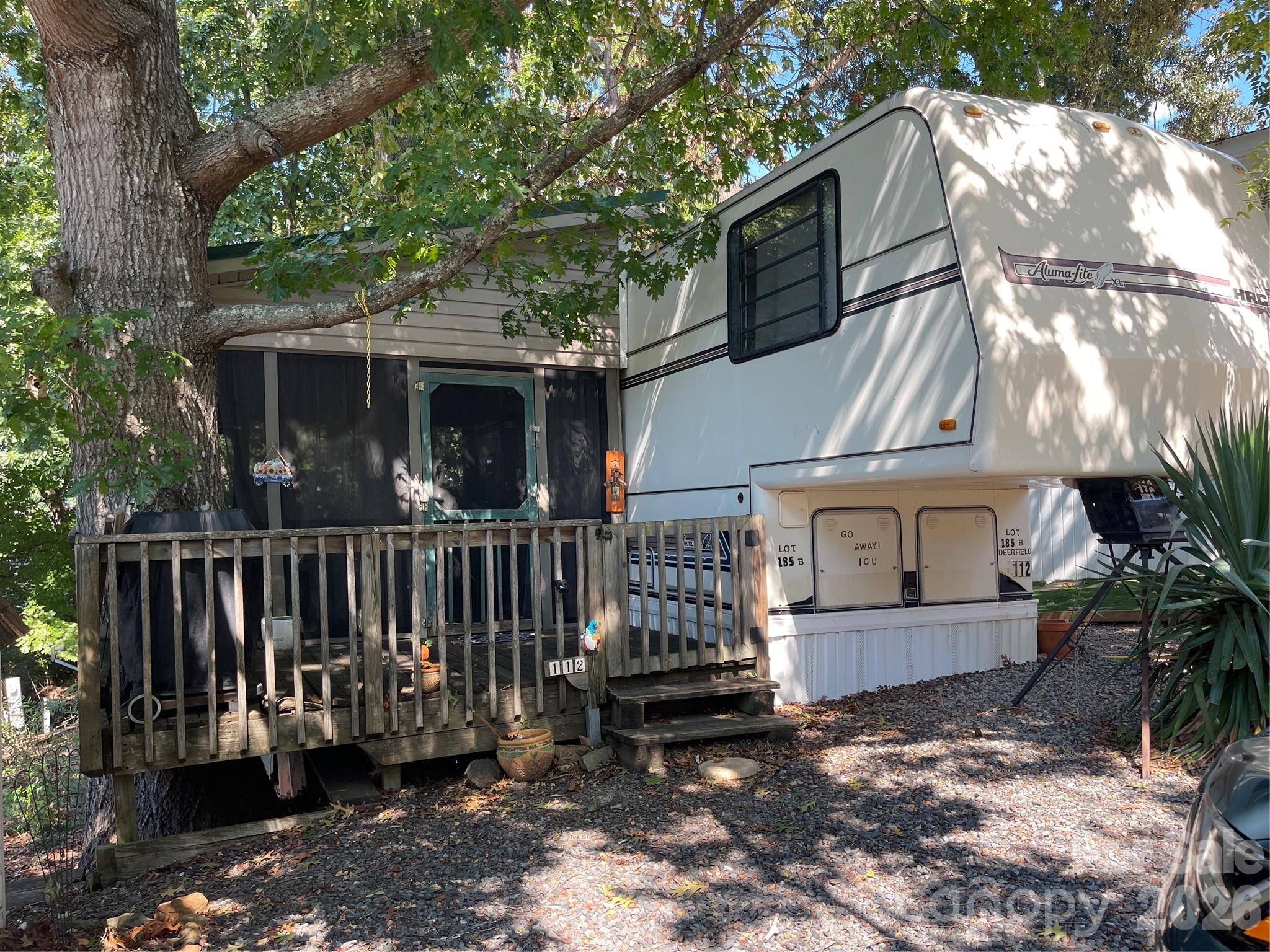 Motivated Seller!!! Bring All Offers!
It's time to get your own lake getaway! The seller enjoyed a Fall/Winter lake-view and limited lakeview Spring/Summer. This is a 1988 Aluma-Lite XL 5th wheel camper located on a deeded lot in Badin Shores resort on Badin Lake. There is a large attached screened porch with a metal roof that is perfect for relaxing or enjoying your morning coffee. Badin Shores offers many amenities: swimming pool, putt-putt course, basketball courts, boat ramp, fishing pier, waterfront boardwalk, and so much more
The main bedroom has a queen size bed. Sofa in living area opens to full-size bed. Futon on porch opens to full-size bed. 
Property located on a shaded lot, on a quiet and short cul-de-sac street.