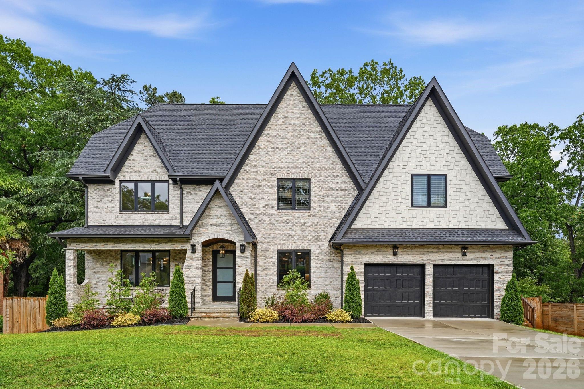 Luxury, location, and timeless design converge in this exceptional newly constructed estate nestled in the heart of Charlotte’s coveted Cotswold neighborhood. Spanning over 5,700 square feet, this stunning 2-story basement home was thoughtfully designed for both sophisticated entertaining and comfortable living. A grand foyer welcomes you into light-filled interiors accented by designer finishes, expansive living spaces, and seamless flow throughout. The chef’s kitchen serves as the centerpiece of the home, featuring premium appliances, custom cabinetry, an oversized island, and open-concept gathering spaces ideal for hosting on any scale. Upstairs, the luxurious primary suite offers a private retreat complete with a spa inspired bath, refined finishes, and an expansive walk in closet. Spacious secondary bedrooms provide comfort and privacy, while the fully finished basement delivers incredible versatility with additional living space, a second kitchen, guest suite, recreation areas, and endless possibilities for multigenerational living, entertaining, or a private retreat. Set within one of Charlotte’s most sought-after neighborhoods, this exceptional property offers the rare combination of luxury new construction, prime location, and refined modern living.