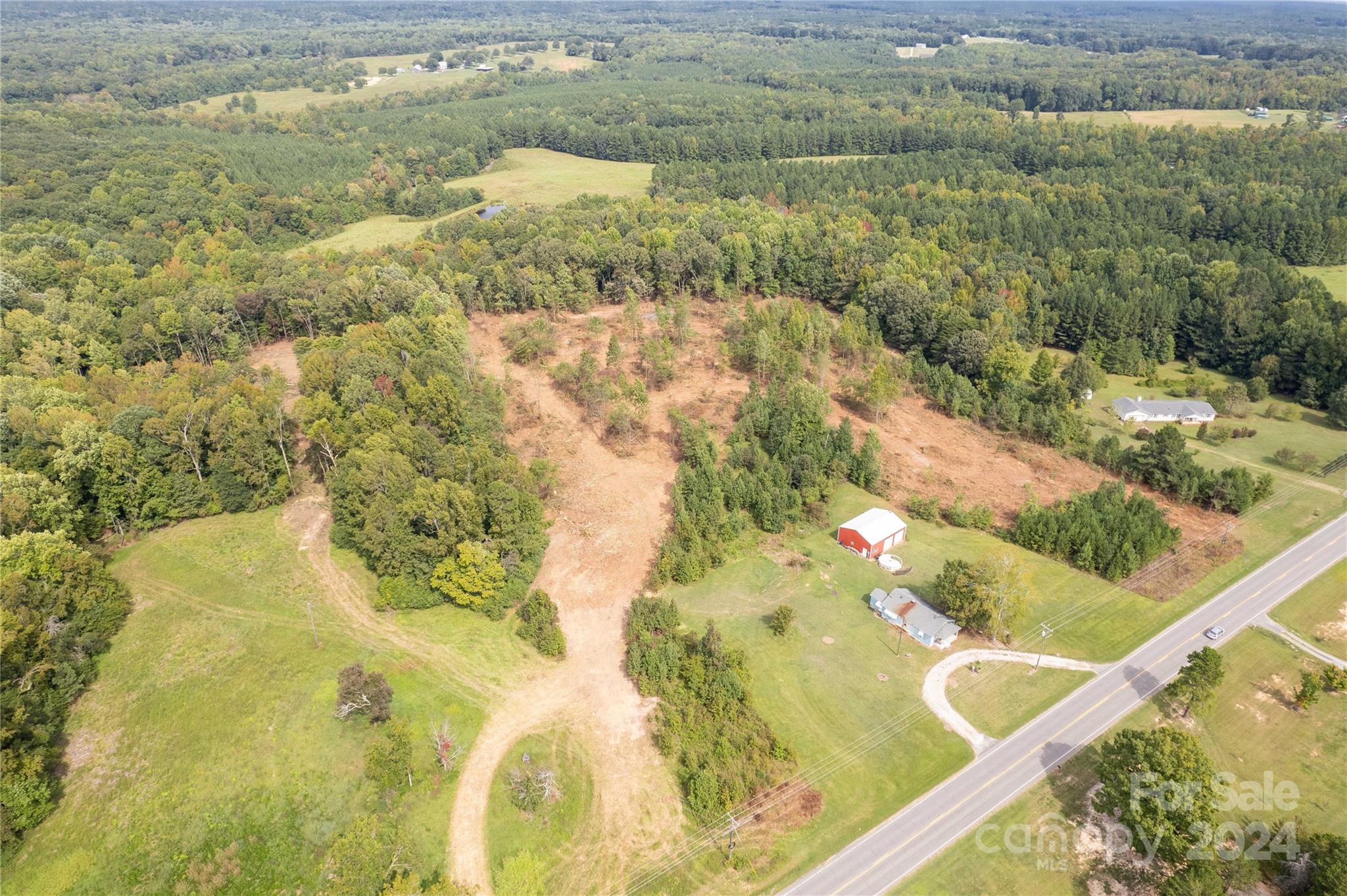 Amazing opportunity to build your private retreat on almost 21 acres! Award winning Clover School District. Close proximity to the town of Clover, Kings Mountain, Lake Wylie and Rock Hill. Property does include a home built in 1942 that is currently lived in by the seller but is sold as is. Also includes metal garage/building. It is a must see.