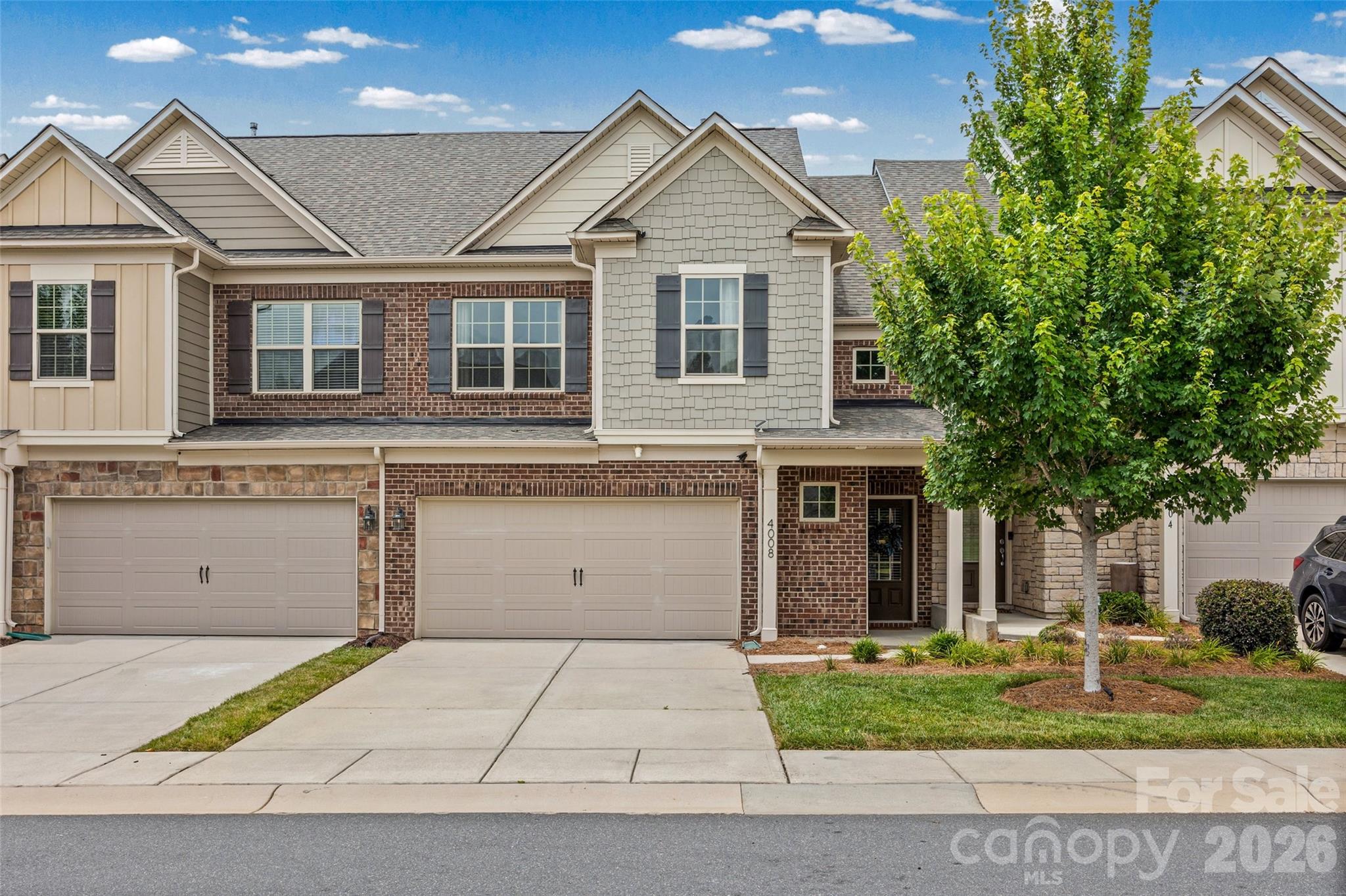 Discover this stunning townhome in the highly sought-after Bridgemill neighborhood—a rare find that perfectly blends beauty, convenience, and location! Step inside this beautifully maintained home and enjoy upgraded luxury vinyl plank flooring throughout the main level. The open floor plan effortlessly connects the living room, kitchen, and expanded sunroom, creating an ideal space for entertaining and everyday living. The gourmet kitchen features gorgeous countertops with a breakfast bar, white cabinets, and stainless steel appliances. Upstairs, the spacious primary bedroom boasts tray ceilings, a huge walk-in closet, and a tiled en-suite bathroom with a walk-in shower and dual vanities. The additional bedrooms are generously sized and filled with natural light. Enjoy exceptional community amenities including two pools, a clubhouse, tennis and pickleball courts, volleyball and basketball courts, plus a dog park. Conveniently located within walking distance to restaurants and shopping, and just minutes from everything you need!