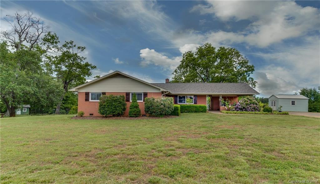 Aqua Fields Farm - For the buyer interested in growing their own food or running a commercial produce operation this property has a 35x96 established Aquaponics greenhouse.  Live in the nicely appointed brick ranch home on 4.46 acres and step out the back door to the greenhouse.  The house has hardwood & tile floors, large eat-in kitchen, new windows, new roof, and a basement.  Fruit & nut bearing trees, 8x12 insulated shed, 12x16 & 10x16 shed.  Home Inspection completed.